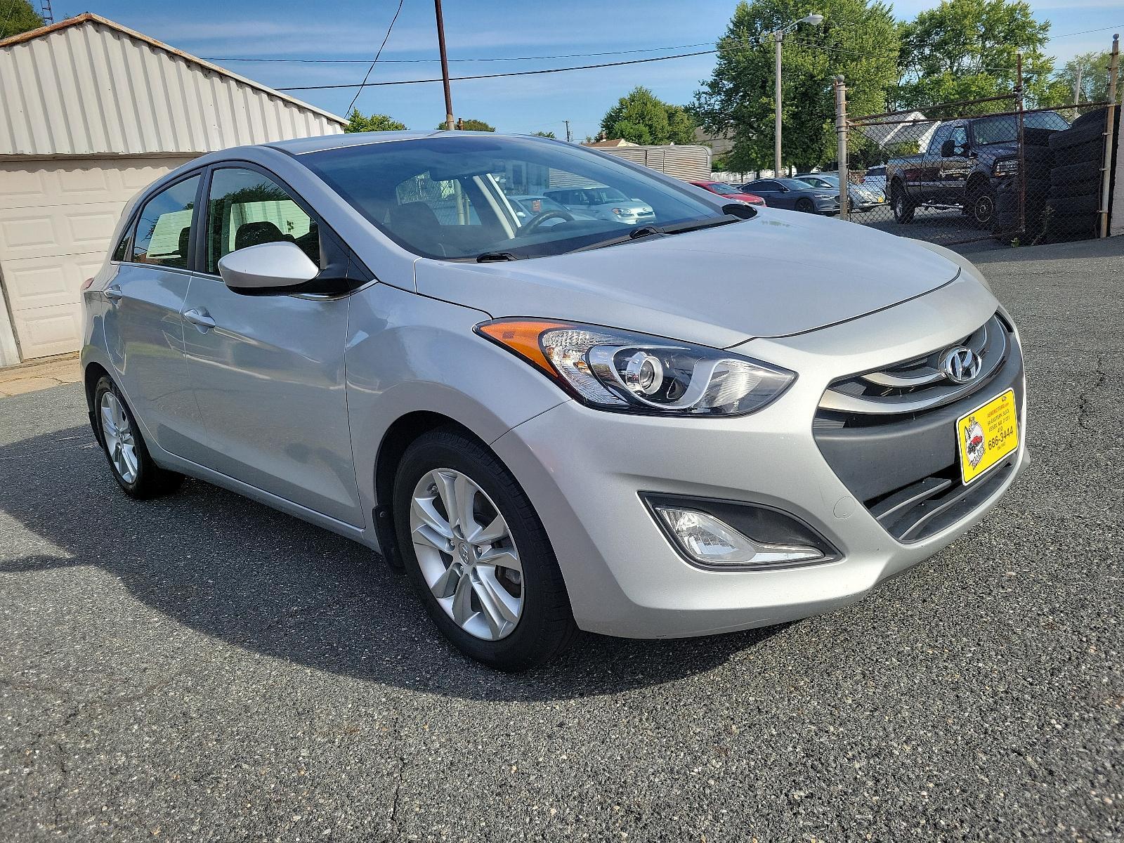 2014 Shimmering Silver - N3S /Black - RY Hyundai Elantra GT (KMHD35LH5EU) with an Engine: 2.0L GDI I4 engine, located at 50 Eastern Blvd., Essex, MD, 21221, (410) 686-3444, 39.304367, -76.484947 - Experience the perfect blend of style, comfort, and performance with this 2014 Hyundai Elantra GT 5dr HB Man. Coated in a radiant shimmering silver exterior, this hatchback stands out in a crowd while the sleek black interior exudes an aura of sophistication and elegance. Powered by a robust 2.0L GD - Photo #2