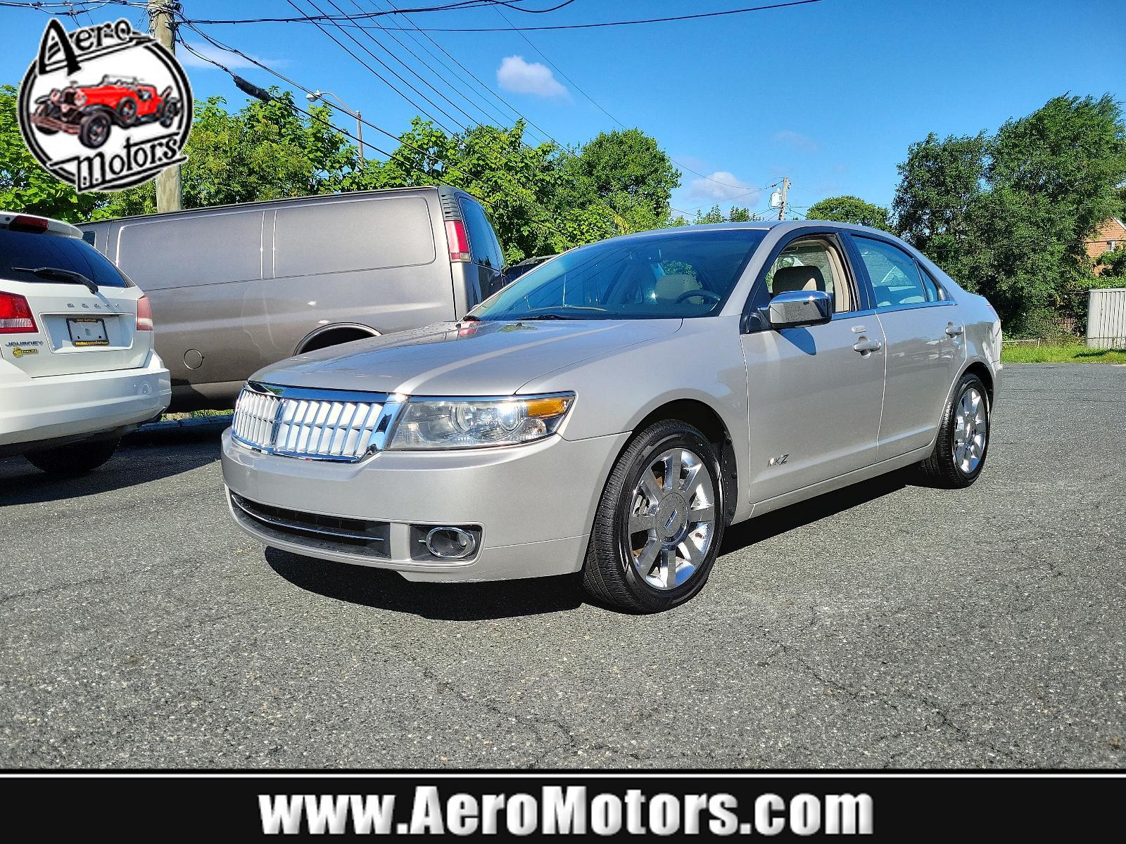 2007 Silver Birch Metallic - JP /Light Stone - T Lincoln MKZ (3LNHM26T77R) with an 3.5L DOHC 4V V6 DURATEC ENGINE engine, located at 50 Eastern Blvd., Essex, MD, 21221, (410) 686-3444, 39.304367, -76.484947 - Introducing the impressive 2007 Lincoln MKZ 4dr Sdn FWD. Finished in an elegant Silver Birch Metallic exterior and a sophisticated Light Stone - T interior, this ride delivers spectacular aesthetics. Under its hood revs a 3.5L DOHC 4V V6 Duratec engine, designed for seamless and efficient performanc - Photo #0