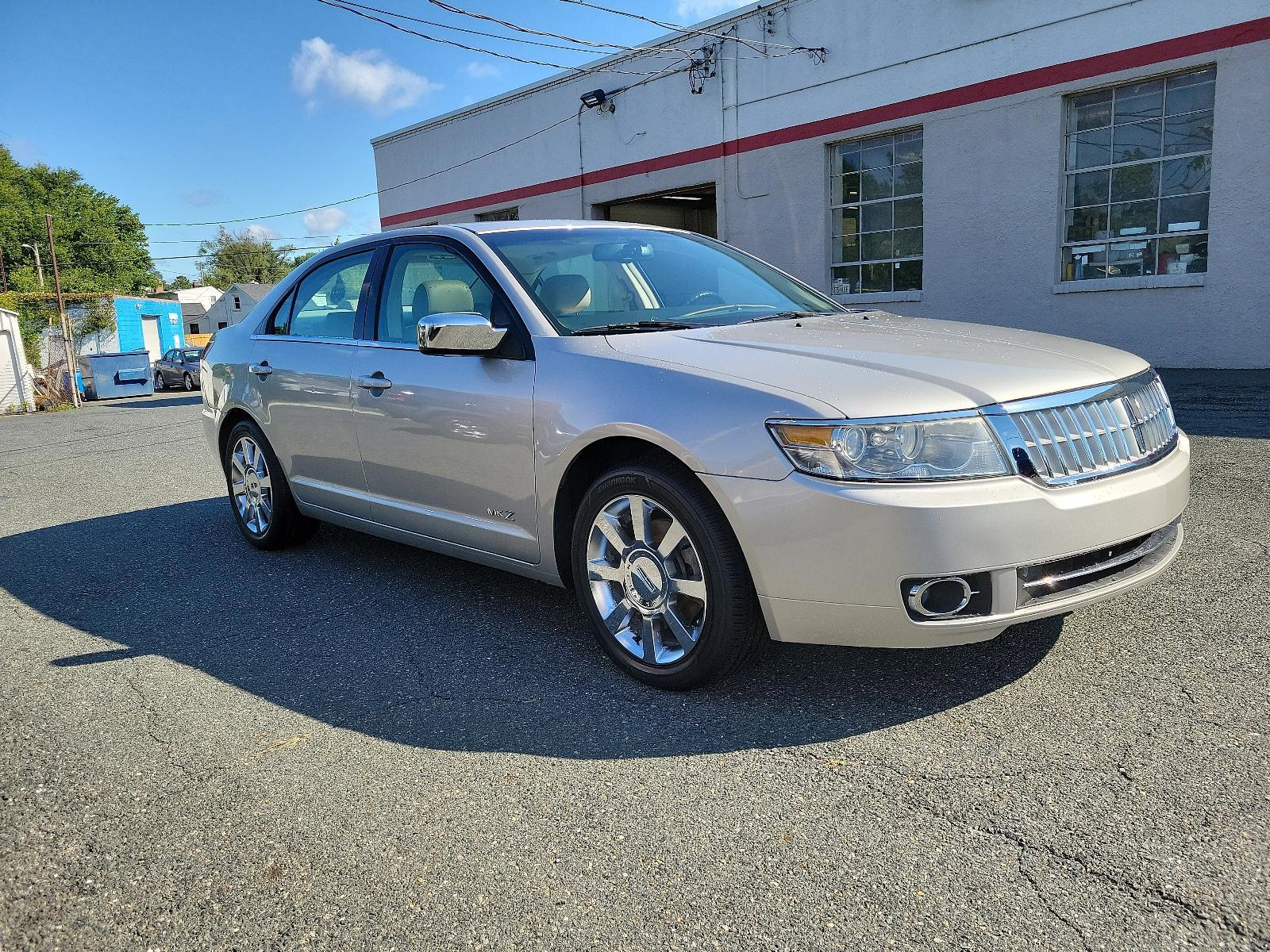 2007 Silver Birch Metallic - JP /Light Stone - T Lincoln MKZ (3LNHM26T77R) with an 3.5L DOHC 4V V6 DURATEC ENGINE engine, located at 50 Eastern Blvd., Essex, MD, 21221, (410) 686-3444, 39.304367, -76.484947 - Introducing the impressive 2007 Lincoln MKZ 4dr Sdn FWD. Finished in an elegant Silver Birch Metallic exterior and a sophisticated Light Stone - T interior, this ride delivers spectacular aesthetics. Under its hood revs a 3.5L DOHC 4V V6 Duratec engine, designed for seamless and efficient performanc - Photo #2