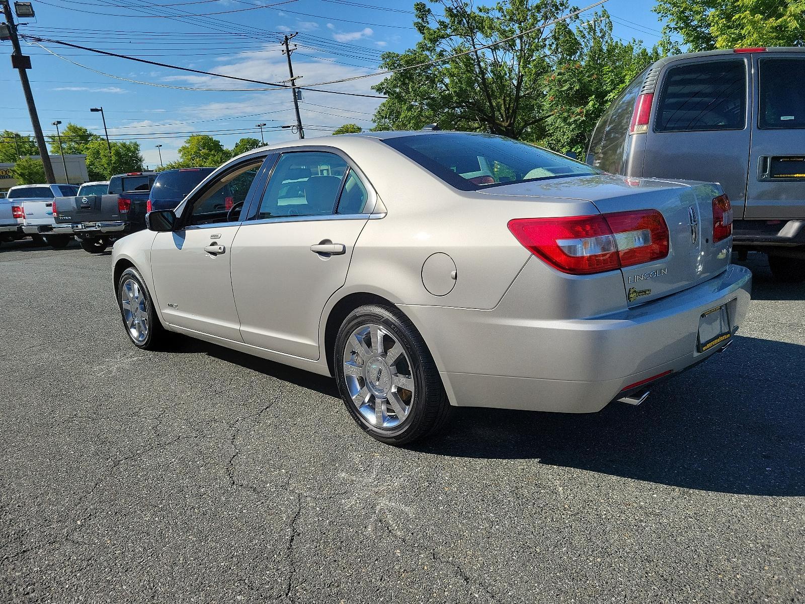 2007 Silver Birch Metallic - JP /Light Stone - T Lincoln MKZ (3LNHM26T77R) with an 3.5L DOHC 4V V6 DURATEC ENGINE engine, located at 50 Eastern Blvd., Essex, MD, 21221, (410) 686-3444, 39.304367, -76.484947 - Introducing the impressive 2007 Lincoln MKZ 4dr Sdn FWD. Finished in an elegant Silver Birch Metallic exterior and a sophisticated Light Stone - T interior, this ride delivers spectacular aesthetics. Under its hood revs a 3.5L DOHC 4V V6 Duratec engine, designed for seamless and efficient performanc - Photo #5