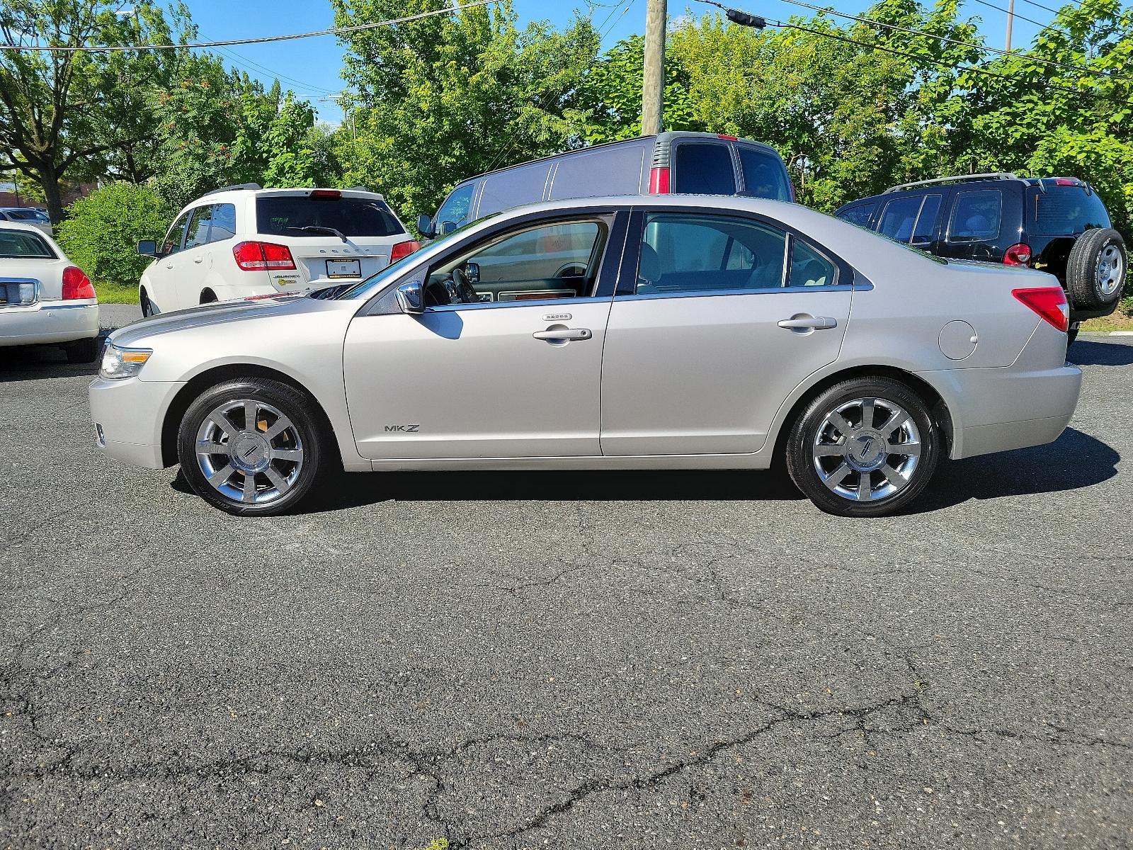 2007 Silver Birch Metallic - JP /Light Stone - T Lincoln MKZ (3LNHM26T77R) with an 3.5L DOHC 4V V6 DURATEC ENGINE engine, located at 50 Eastern Blvd., Essex, MD, 21221, (410) 686-3444, 39.304367, -76.484947 - Introducing the impressive 2007 Lincoln MKZ 4dr Sdn FWD. Finished in an elegant Silver Birch Metallic exterior and a sophisticated Light Stone - T interior, this ride delivers spectacular aesthetics. Under its hood revs a 3.5L DOHC 4V V6 Duratec engine, designed for seamless and efficient performanc - Photo #6