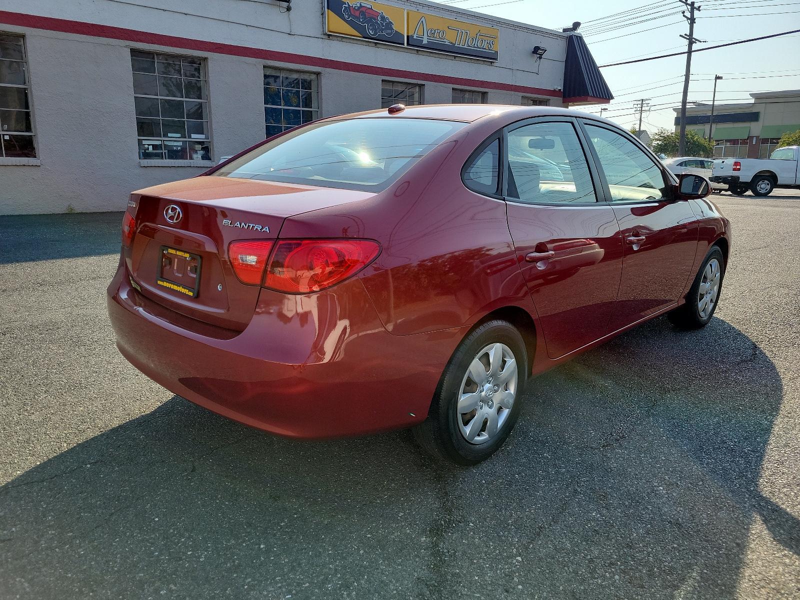 2008 Apple Red Pearl - ND /Beige - 9K Hyundai Elantra GLS (KMHDU46D48U) with an 2.0L DOHC CVVT 16-valve I4 engine engine, located at 50 Eastern Blvd., Essex, MD, 21221, (410) 686-3444, 39.304367, -76.484947 - Discover the impeccable marriage of efficiency and elegance in this 2008 Hyundai Elantra GLS 4dr Sedan. The stunning Apple Red Pearl exterior is sheer sophistication, ensuring a bold on-road presence. Inside, you are presented with an immaculate and welcoming Beige interior, exuding an aura of comfo - Photo #3