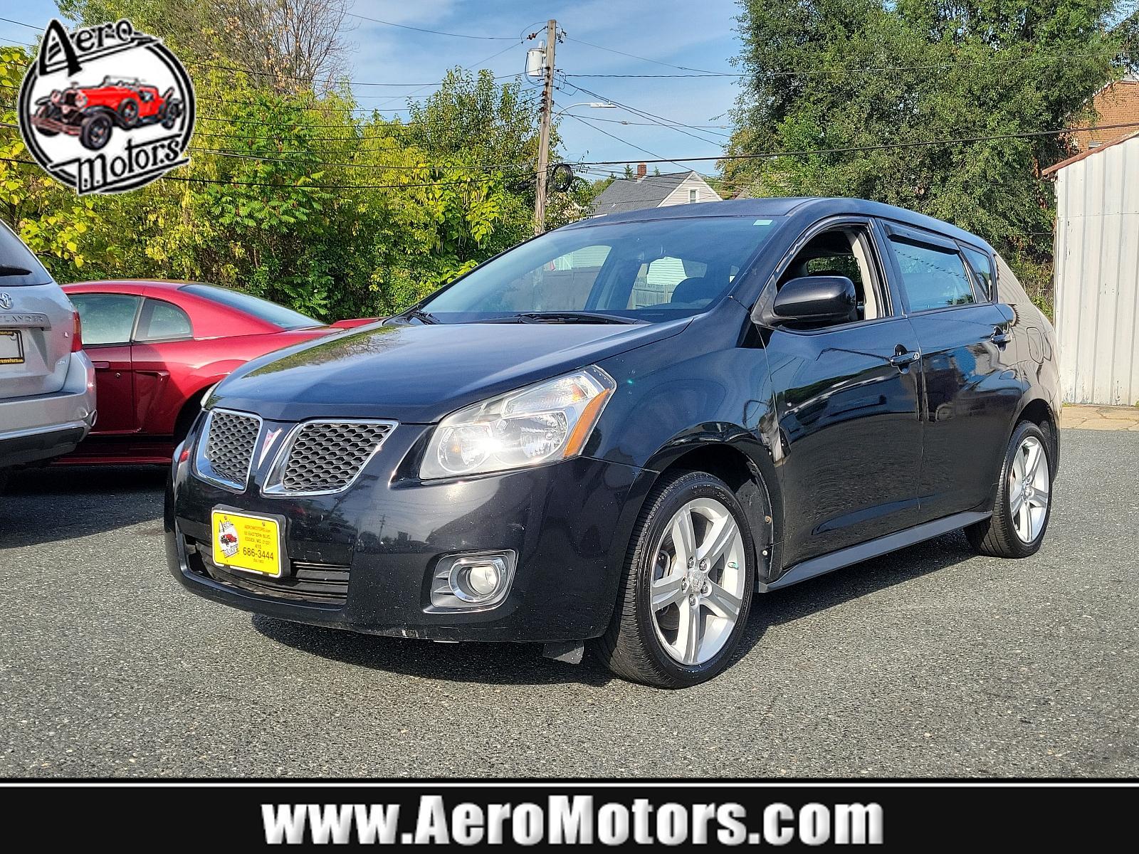 2009 Jet Black Metallic - 19U /Ebony - 14C Pontiac Vibe w/1SB (5Y2SP67059Z) with an ENGINE, 2.4L VARIABLE VALVE TIMING INTELLIGENCE 4-CYLINDER engine, located at 50 Eastern Blvd., Essex, MD, 21221, (410) 686-3444, 39.304367, -76.484947 - Rev up your daily commute with this stylish 2009 Pontiac Vibe w/1SB 4dr hb fwd w/1sb. Its radiant jet black metallic exterior and sophisticated ebony interior create a stunning visual contrast. Under the hood, the car is equipped with a 2.4L Variable Valve Timing Intelligence 4-Cylinder engine which - Photo #0