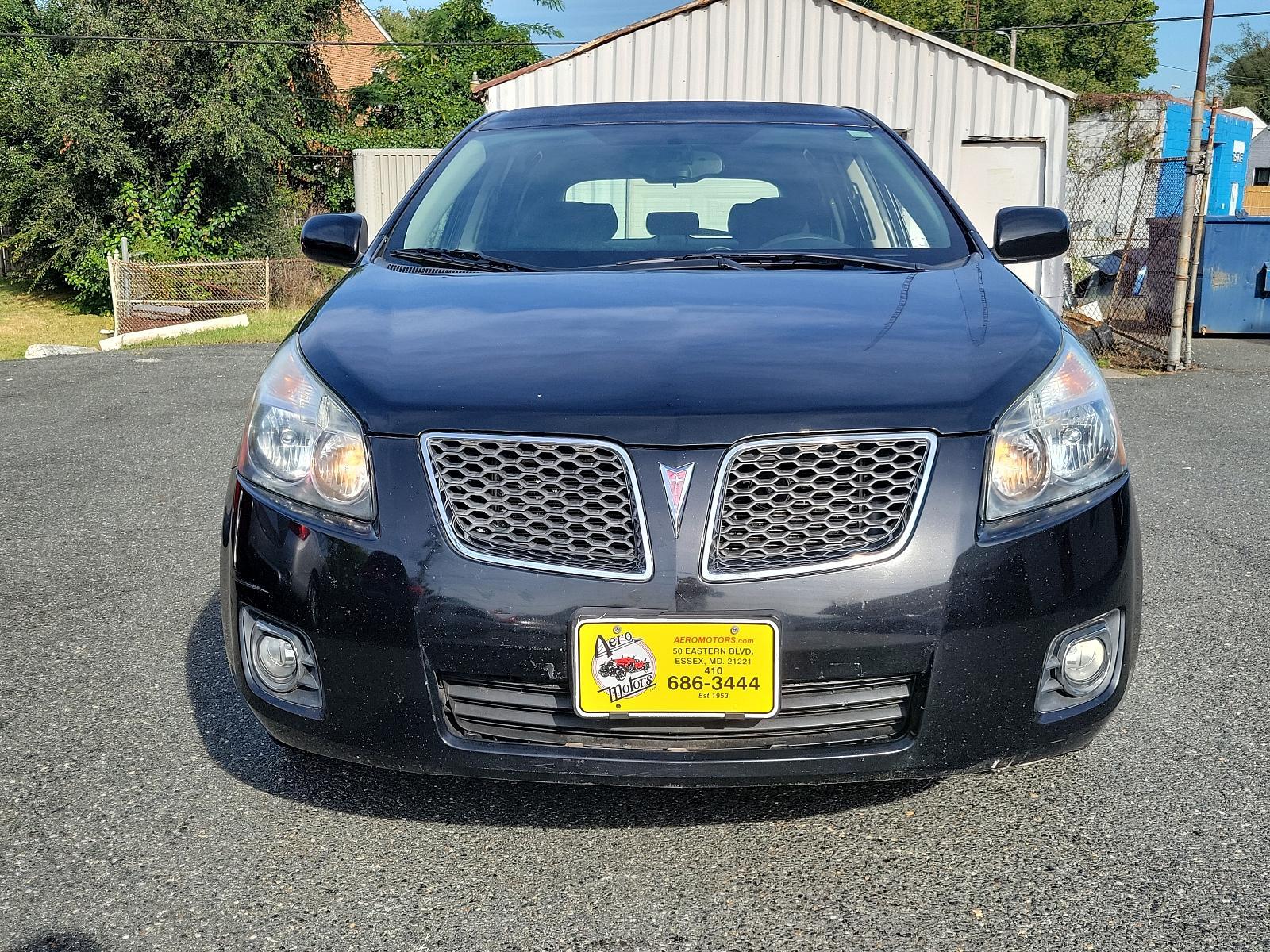 2009 Jet Black Metallic - 19U /Ebony - 14C Pontiac Vibe w/1SB (5Y2SP67059Z) with an ENGINE, 2.4L VARIABLE VALVE TIMING INTELLIGENCE 4-CYLINDER engine, located at 50 Eastern Blvd., Essex, MD, 21221, (410) 686-3444, 39.304367, -76.484947 - Rev up your daily commute with this stylish 2009 Pontiac Vibe w/1SB 4dr hb fwd w/1sb. Its radiant jet black metallic exterior and sophisticated ebony interior create a stunning visual contrast. Under the hood, the car is equipped with a 2.4L Variable Valve Timing Intelligence 4-Cylinder engine which - Photo #1