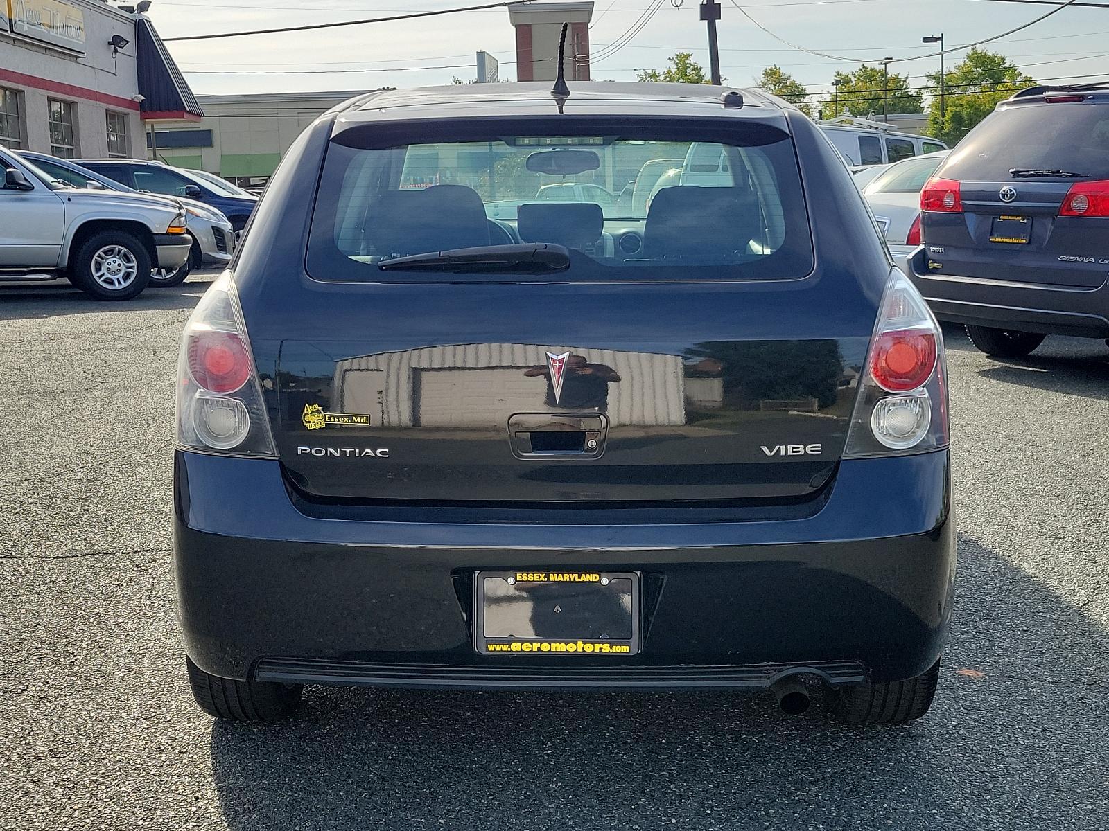 2009 Jet Black Metallic - 19U /Ebony - 14C Pontiac Vibe w/1SB (5Y2SP67059Z) with an ENGINE, 2.4L VARIABLE VALVE TIMING INTELLIGENCE 4-CYLINDER engine, located at 50 Eastern Blvd., Essex, MD, 21221, (410) 686-3444, 39.304367, -76.484947 - Rev up your daily commute with this stylish 2009 Pontiac Vibe w/1SB 4dr hb fwd w/1sb. Its radiant jet black metallic exterior and sophisticated ebony interior create a stunning visual contrast. Under the hood, the car is equipped with a 2.4L Variable Valve Timing Intelligence 4-Cylinder engine which - Photo #4