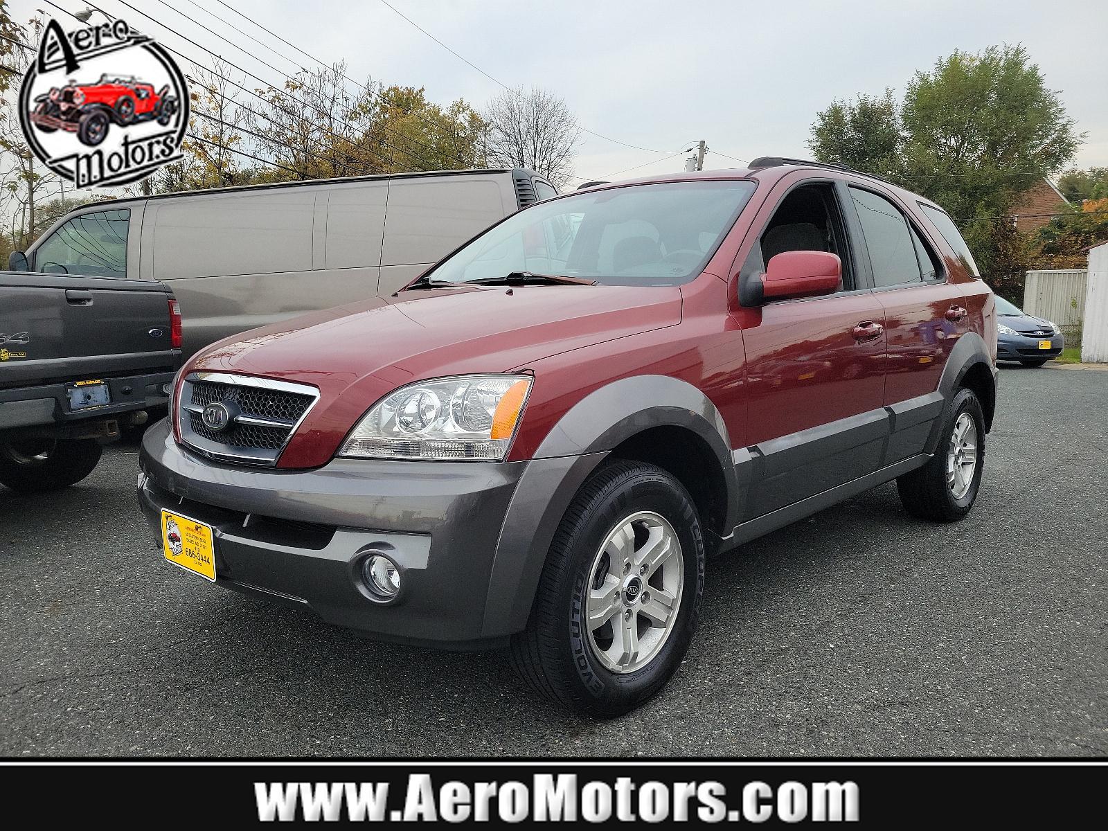 2005 Radiant Red - 3X /Gray - CY Kia Sorento EX (KNDJC733155) with an 3.5L DOHC MPFI 24-valve V6 engine engine, located at 50 Eastern Blvd., Essex, MD, 21221, (410) 686-3444, 39.304367, -76.484947 - Experience the dependable quality of this immaculate 2005 Kia Sorento EX 4dr ex 4wd auto. Boasting a radiant red 3x exterior, this stylish SUV surely stands out on the road. Step inside and appreciate the tastefully designed gray cy interior, offering comfort and functionality for all your travels. - Photo #0
