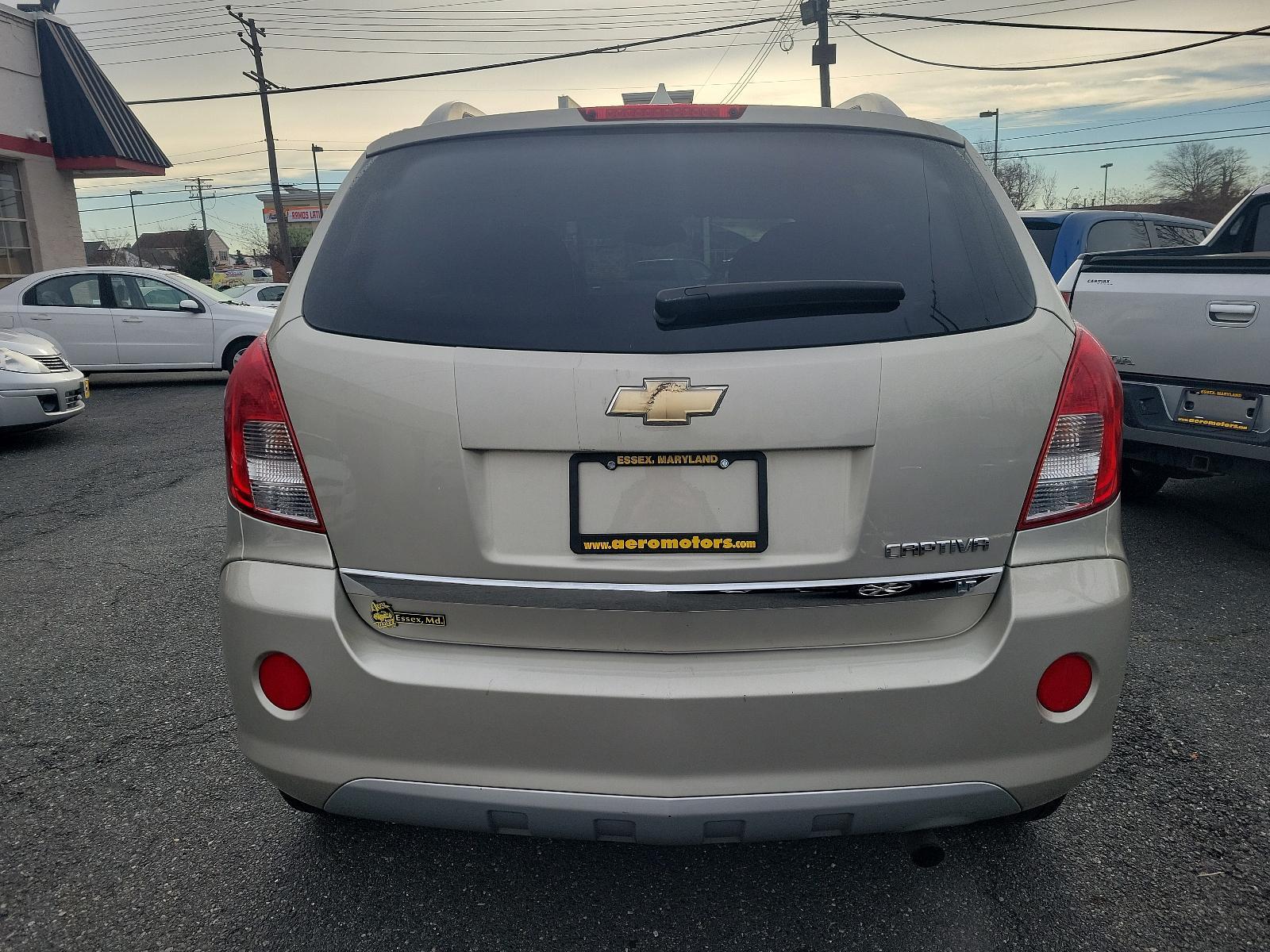 2014 Champagne Silver Metallic - GWT /Black - ADW Chevrolet Captiva Sport Fleet LT (3GNAL3EKXES) with an ENGINE, 2.4L DOHC 4-CYLINDER SIDI (SPARK IGNITION DIRECT INJECTION) engine, located at 50 Eastern Blvd., Essex, MD, 21221, (410) 686-3444, 39.304367, -76.484947 - Experience the perfect blend of performance and luxury with our 2014 Chevrolet Captiva Sport Fleet LT. This chic SUV boasts a stunning champagne silver metallic exterior complemented by a clean, sleek black interior. Propelled by a powerful 2.4L DOHC 4-cylinder SIDI (Spark Ignition Direct Injection) - Photo #4