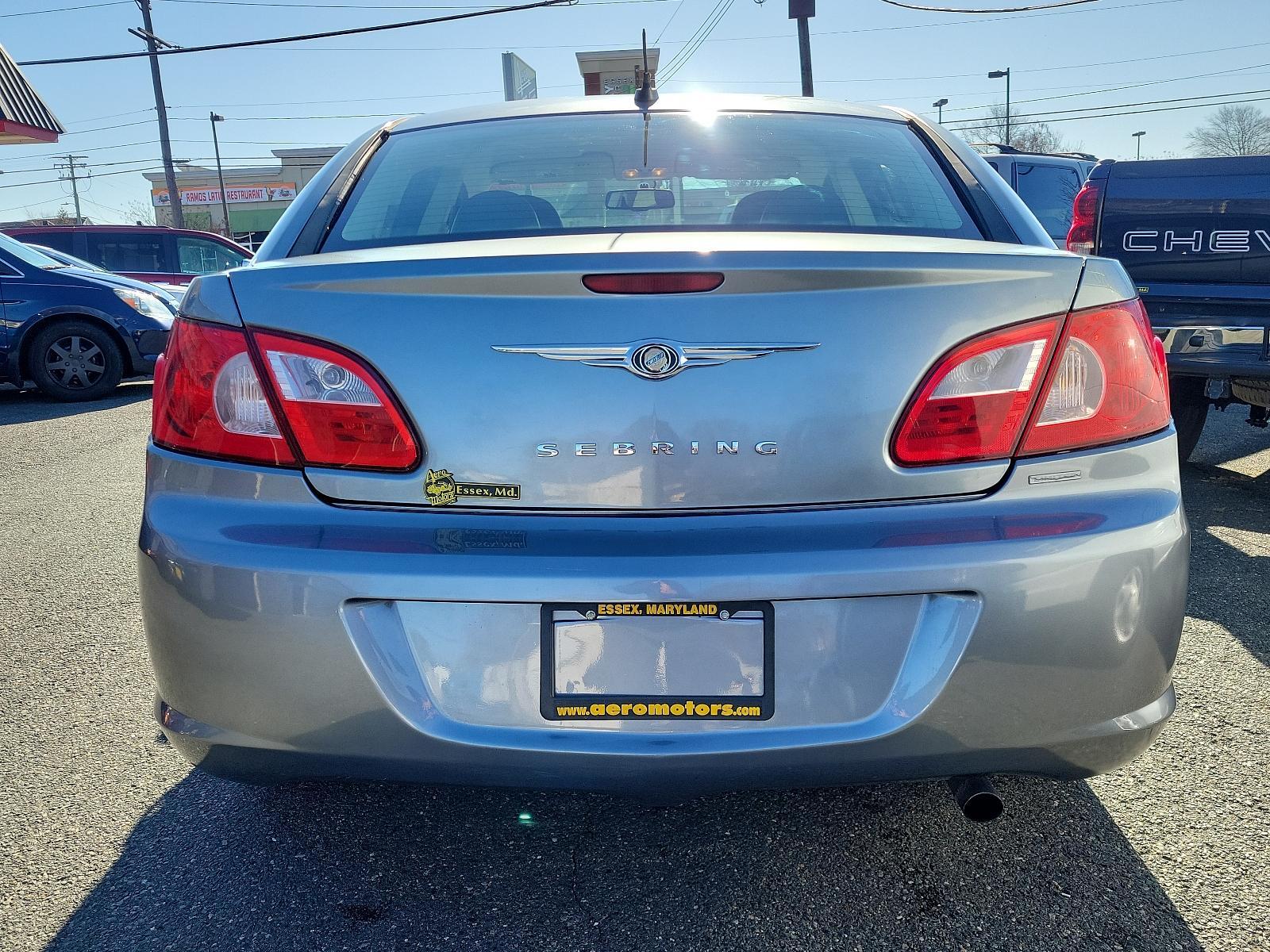 2007 Silver Steel Metallic - PA4 /Dark/Light Slate Gray - DB Chrysler Sebring Sdn Limited (1C3LC66K57N) with an 2.4L SMPI DOHC 16-VALVE I4 DUAL VVT ENGINE engine, located at 50 Eastern Blvd., Essex, MD, 21221, (410) 686-3444, 39.304367, -76.484947 - Discover the perfect blend of style, comfort and performance with this 2007 Chrysler Sebring Sdn Limited 4dr. Finished in an alluring Silver Steel Metallic - PA4 exterior paired beautifully with the plush Dark/Light Slate Gray - DB interior, it exhibits a sleek, chic aesthetic that's sure to turn he - Photo #4