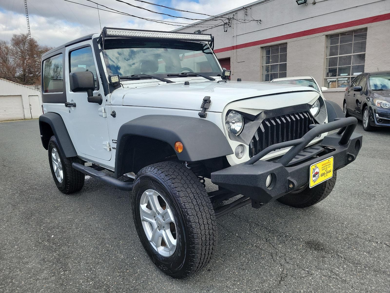 2015 Bright White Clearcoat - PW7 /Black - A7X9 Jeep Wrangler Sport (1C4AJWAGXFL) with an ENGINE: 3.6L V6 24V VVT engine, located at 50 Eastern Blvd., Essex, MD, 21221, (410) 686-3444, 39.304367, -76.484947 - Experience the thrill of off-road adventure with the 2015 Jeep Wrangler Sport 4WD 2dr Sport. This bold, white clearcoat exterior vehicle is powered by a 3.6L V6 24V VVT engine, ensuring unparalleled performance on any landscape. The accent-black interior imbues sophistication and comfort throughout - Photo #2