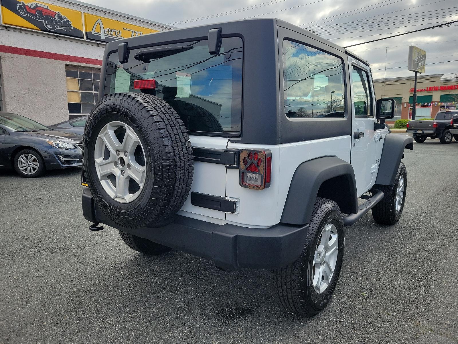 2015 Bright White Clearcoat - PW7 /Black - A7X9 Jeep Wrangler Sport (1C4AJWAGXFL) with an ENGINE: 3.6L V6 24V VVT engine, located at 50 Eastern Blvd., Essex, MD, 21221, (410) 686-3444, 39.304367, -76.484947 - Experience the thrill of off-road adventure with the 2015 Jeep Wrangler Sport 4WD 2dr Sport. This bold, white clearcoat exterior vehicle is powered by a 3.6L V6 24V VVT engine, ensuring unparalleled performance on any landscape. The accent-black interior imbues sophistication and comfort throughout - Photo #3