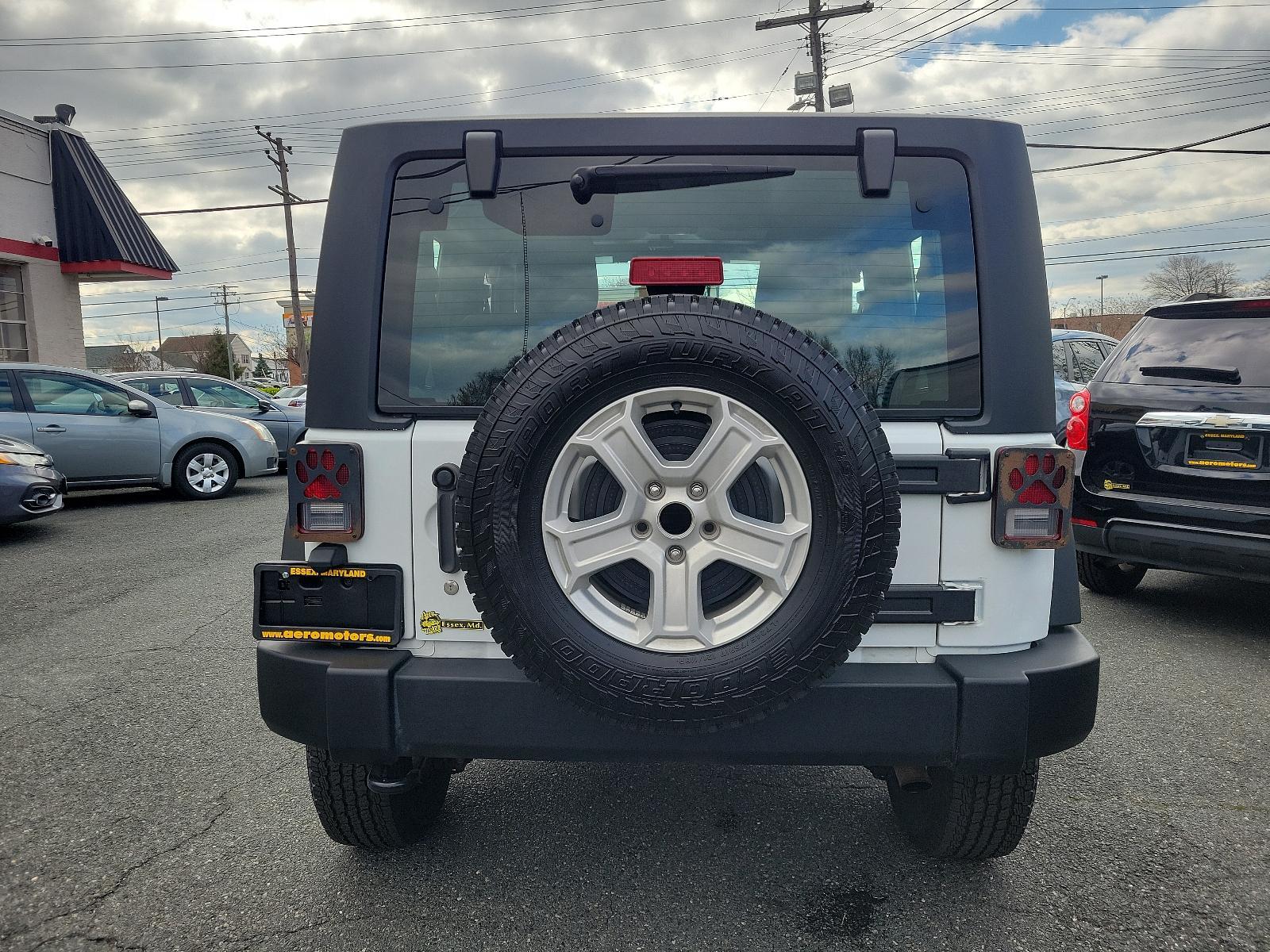 2015 Bright White Clearcoat - PW7 /Black - A7X9 Jeep Wrangler Sport (1C4AJWAGXFL) with an ENGINE: 3.6L V6 24V VVT engine, located at 50 Eastern Blvd., Essex, MD, 21221, (410) 686-3444, 39.304367, -76.484947 - Experience the thrill of off-road adventure with the 2015 Jeep Wrangler Sport 4WD 2dr Sport. This bold, white clearcoat exterior vehicle is powered by a 3.6L V6 24V VVT engine, ensuring unparalleled performance on any landscape. The accent-black interior imbues sophistication and comfort throughout - Photo #4