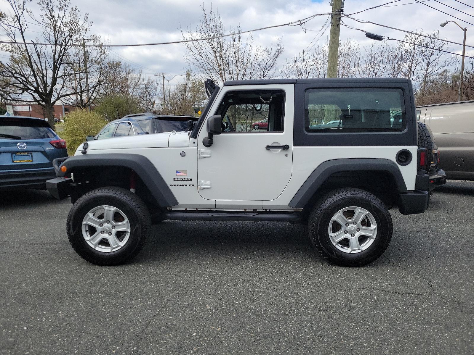 2015 Bright White Clearcoat - PW7 /Black - A7X9 Jeep Wrangler Sport (1C4AJWAGXFL) with an ENGINE: 3.6L V6 24V VVT engine, located at 50 Eastern Blvd., Essex, MD, 21221, (410) 686-3444, 39.304367, -76.484947 - Experience the thrill of off-road adventure with the 2015 Jeep Wrangler Sport 4WD 2dr Sport. This bold, white clearcoat exterior vehicle is powered by a 3.6L V6 24V VVT engine, ensuring unparalleled performance on any landscape. The accent-black interior imbues sophistication and comfort throughout - Photo #6