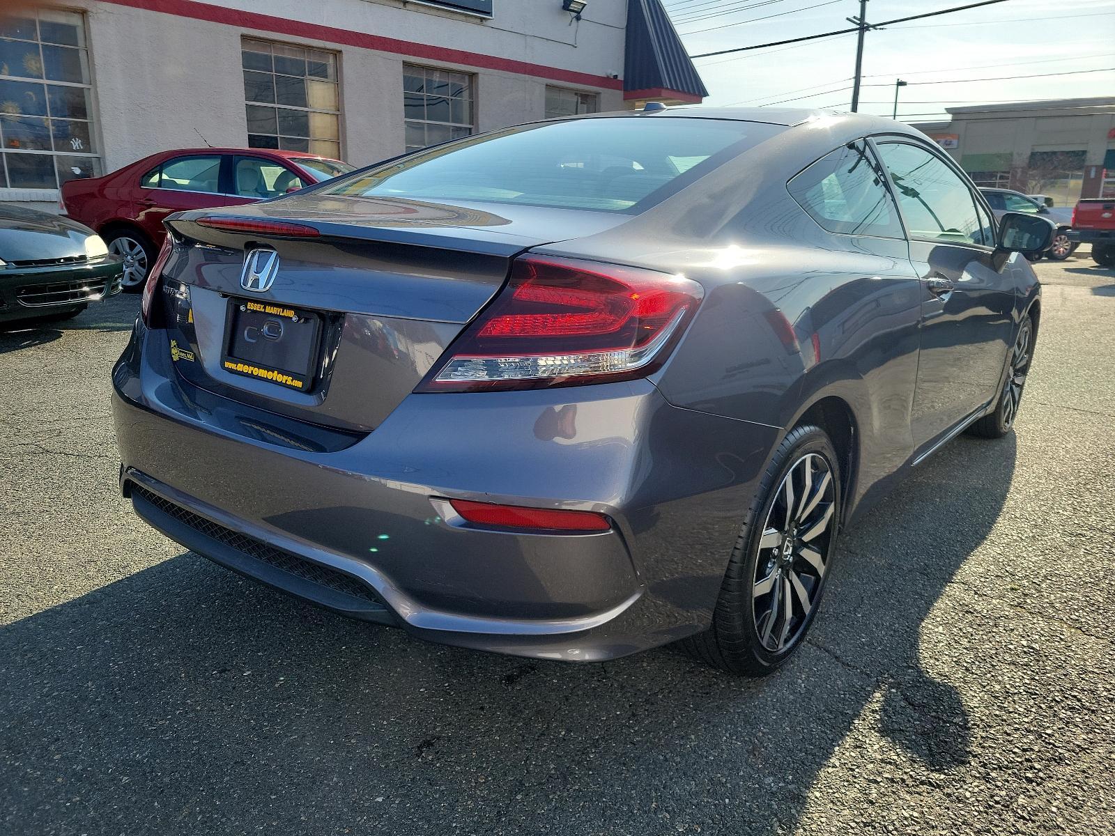 2015 Modern Steel Metallic - GX /Gray - GR Honda Civic Coupe EX-L (2HGFG3B05FH) with an Engine: 1.8L I-4 SOHC 16-Valve i-VTEC engine, located at 50 Eastern Blvd., Essex, MD, 21221, (410) 686-3444, 39.304367, -76.484947 - Experience superior performance and stylish comfort with the 2015 Honda Civic Coupe EX-L. Dressed elegantly in a modern steel metallic GX exterior, this coupe boasts a slick design that never goes unnoticed. Its inviting interior is swathed in refined gray tones, presenting a harmonious blend of sty - Photo #3