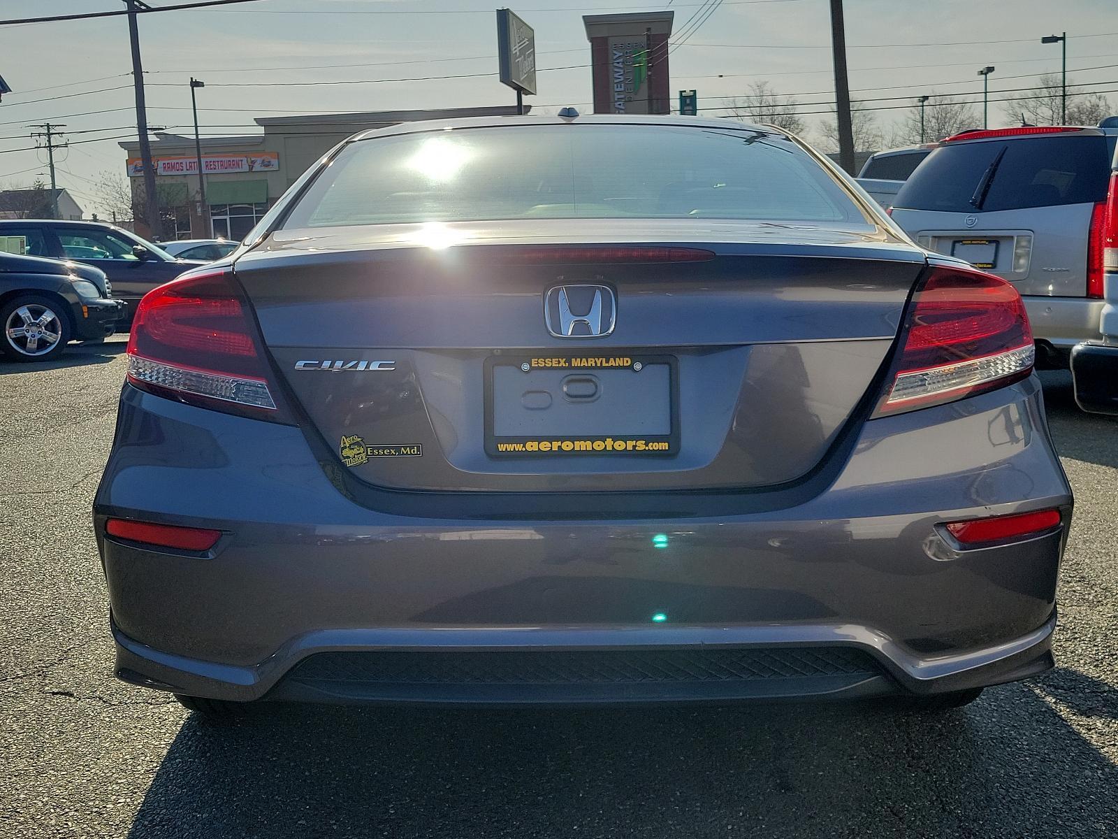 2015 Modern Steel Metallic - GX /Gray - GR Honda Civic Coupe EX-L (2HGFG3B05FH) with an Engine: 1.8L I-4 SOHC 16-Valve i-VTEC engine, located at 50 Eastern Blvd., Essex, MD, 21221, (410) 686-3444, 39.304367, -76.484947 - Experience superior performance and stylish comfort with the 2015 Honda Civic Coupe EX-L. Dressed elegantly in a modern steel metallic GX exterior, this coupe boasts a slick design that never goes unnoticed. Its inviting interior is swathed in refined gray tones, presenting a harmonious blend of sty - Photo #4