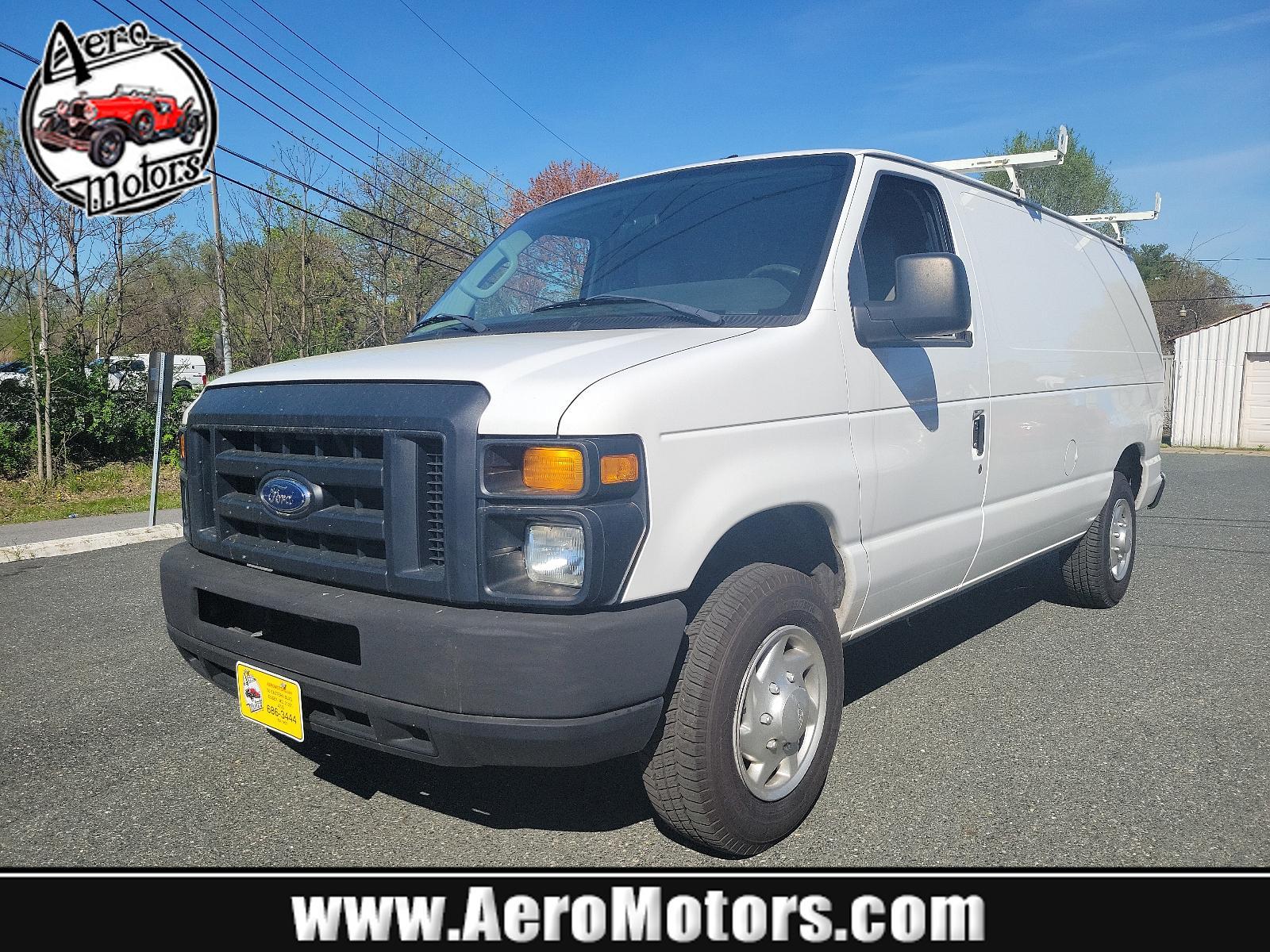 2014 Oxford White - YZ /Medium Flint - AE Ford Econoline Cargo Van Commercial (1FTNE1EW6ED) with an ENGINE: 4.6L EFI V8 FFV CAPABLE engine, located at 50 Eastern Blvd., Essex, MD, 21221, (410) 686-3444, 39.304367, -76.484947 - Introducing the 2014 Ford Econoline E-150 Commercial Cargo Van, dressed in a pristine white exterior. This is a reliable powerhouse built to serve all your commercial needs. Under the hood sits a robust 4.6L EFI V8 FFV capable engine, designed for performance and efficiency, thereby reinforcing Ford - Photo #0