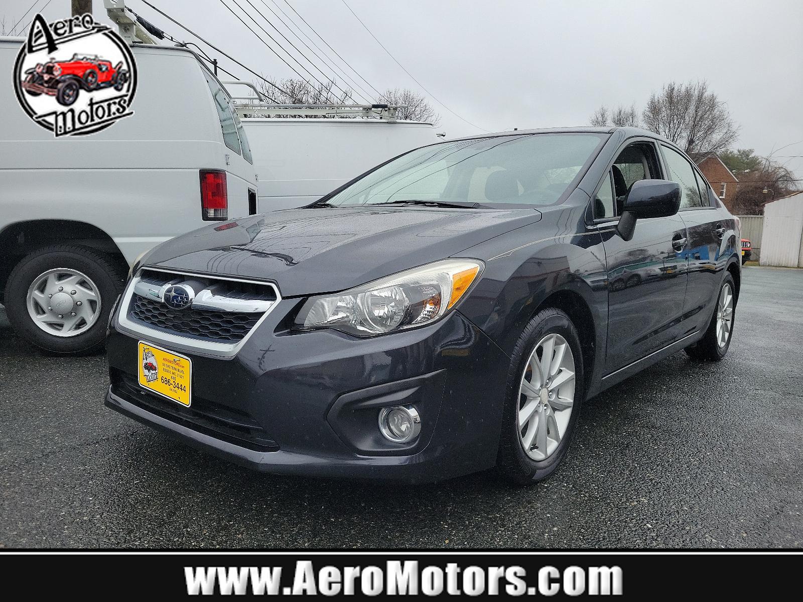 2014 Dark Gray Metallic - DGM /Black - BT20 Subaru Impreza Sedan Premium (JF1GJAC60EH) with an Engine: 2.0L DOHC 16V 4-Cylinder SMFI -inc: Electronic Throttle Control (ETC) engine, located at 50 Eastern Blvd., Essex, MD, 21221, (410) 686-3444, 39.304367, -76.484947 - Discover the thrill of driving in this sleek 2014 Subaru Impreza Sedan Premium, elegantly presented in a dark gray metallic exterior with a pristine black interior. This four-door marvel boasts a robust 2.0L DOHC 16V 4-Cylinder SMFI engine, designed with advanced electronic throttle control (ETC) to - Photo #0