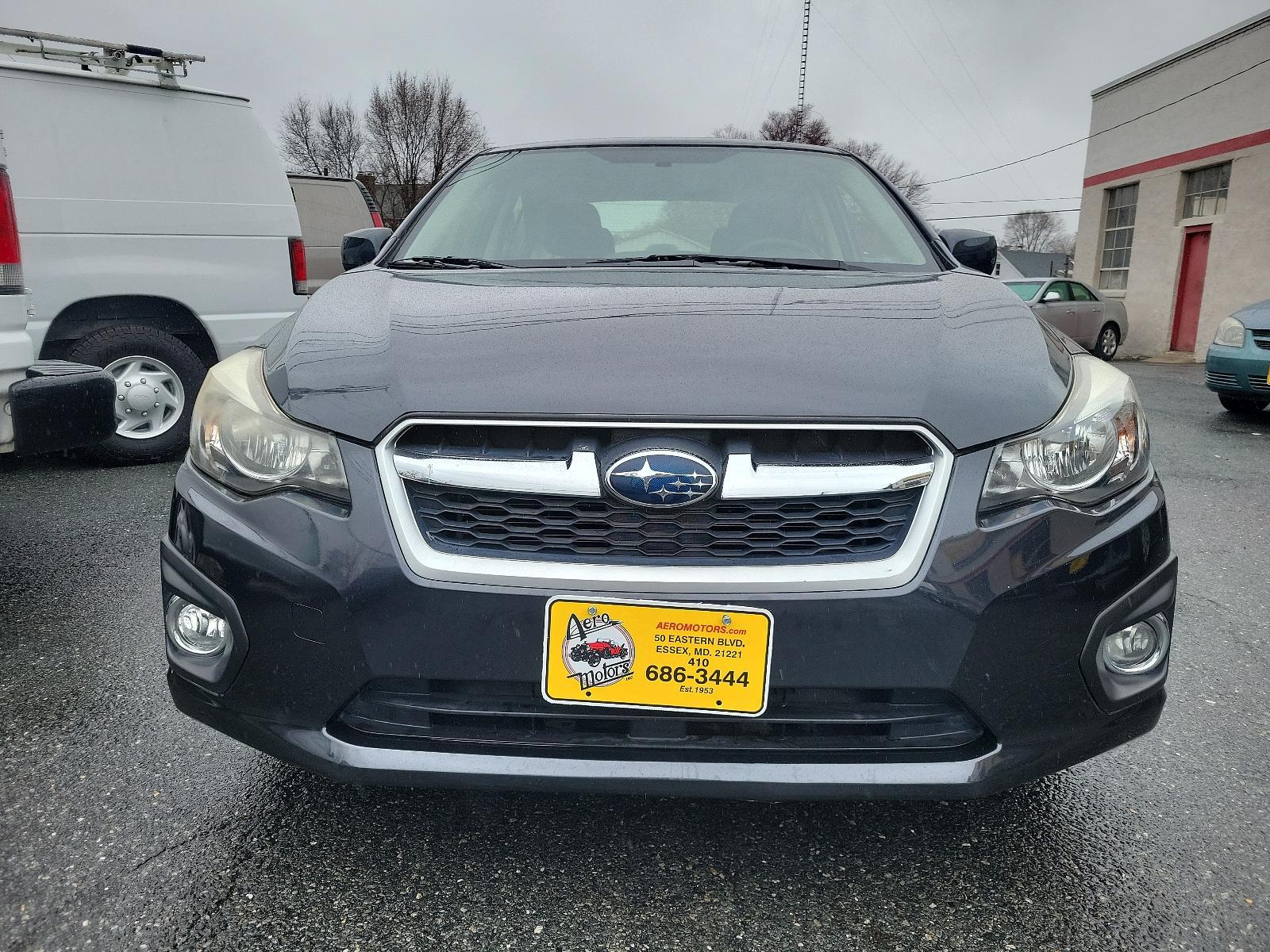 2014 Dark Gray Metallic - DGM /Black - BT20 Subaru Impreza Sedan Premium (JF1GJAC60EH) with an Engine: 2.0L DOHC 16V 4-Cylinder SMFI -inc: Electronic Throttle Control (ETC) engine, located at 50 Eastern Blvd., Essex, MD, 21221, (410) 686-3444, 39.304367, -76.484947 - Discover the thrill of driving in this sleek 2014 Subaru Impreza Sedan Premium, elegantly presented in a dark gray metallic exterior with a pristine black interior. This four-door marvel boasts a robust 2.0L DOHC 16V 4-Cylinder SMFI engine, designed with advanced electronic throttle control (ETC) to - Photo #1