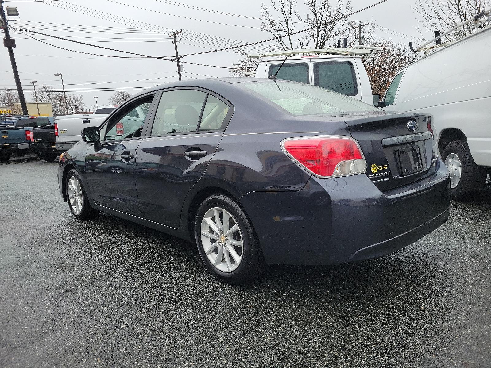 2014 Dark Gray Metallic - DGM /Black - BT20 Subaru Impreza Sedan Premium (JF1GJAC60EH) with an Engine: 2.0L DOHC 16V 4-Cylinder SMFI -inc: Electronic Throttle Control (ETC) engine, located at 50 Eastern Blvd., Essex, MD, 21221, (410) 686-3444, 39.304367, -76.484947 - Discover the thrill of driving in this sleek 2014 Subaru Impreza Sedan Premium, elegantly presented in a dark gray metallic exterior with a pristine black interior. This four-door marvel boasts a robust 2.0L DOHC 16V 4-Cylinder SMFI engine, designed with advanced electronic throttle control (ETC) to - Photo #5