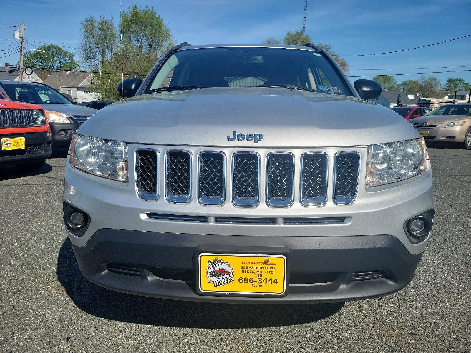 2013 Bright Silver Metallic - PS2 /Dark Slate Gray Interior - C7DV Jeep Compass Sport (1C4NJDBB6DD) with an 2.4L DOHC 16V I4 DUAL-VVT ENGINE engine, located at 50 Eastern Blvd., Essex, MD, 21221, (410) 686-3444, 39.304367, -76.484947 - Experience the thrill of road adventure with the 2013 Jeep Compass Sport 4WD 4dr Sport! Boasting a bright silver metallic - ps2 exterior with a sleek, dark slate gray interior - c7dv, it's sure to elevate your driving experience to new heights. Under the hood, navigate terrains with ease, thanks to - Photo #1