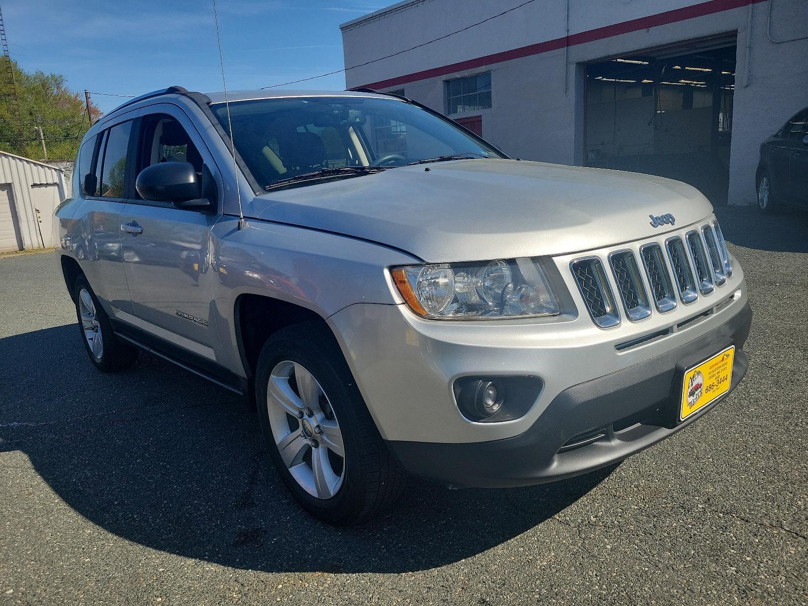 2013 Bright Silver Metallic - PS2 /Dark Slate Gray Interior - C7DV Jeep Compass Sport (1C4NJDBB6DD) with an 2.4L DOHC 16V I4 DUAL-VVT ENGINE engine, located at 50 Eastern Blvd., Essex, MD, 21221, (410) 686-3444, 39.304367, -76.484947 - Experience the thrill of road adventure with the 2013 Jeep Compass Sport 4WD 4dr Sport! Boasting a bright silver metallic - ps2 exterior with a sleek, dark slate gray interior - c7dv, it's sure to elevate your driving experience to new heights. Under the hood, navigate terrains with ease, thanks to - Photo #2