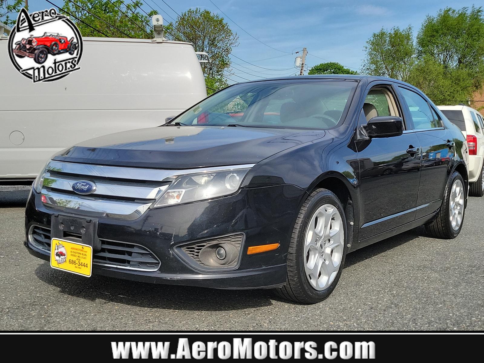 2010 Tuxedo Black Metallic - UH /Medium Light Stone - DL Ford Fusion SE (3FAHP0HG1AR) with an 3.0L 24V V6 DURATEC FLEX FUEL ENGINE engine, located at 50 Eastern Blvd., Essex, MD, 21221, (410) 686-3444, 39.304367, -76.484947 - Experience the perfect blend of style, comfort, and performance with this impeccable 2010 Ford Fusion SE Sedan. Showcased in sophisticated Tuxedo Black Metallic paintwork, this 4-door delight boasts a Medium Light Stone interior that promotes a sophisticated environment. Under the hood, you'll disco - Photo #0