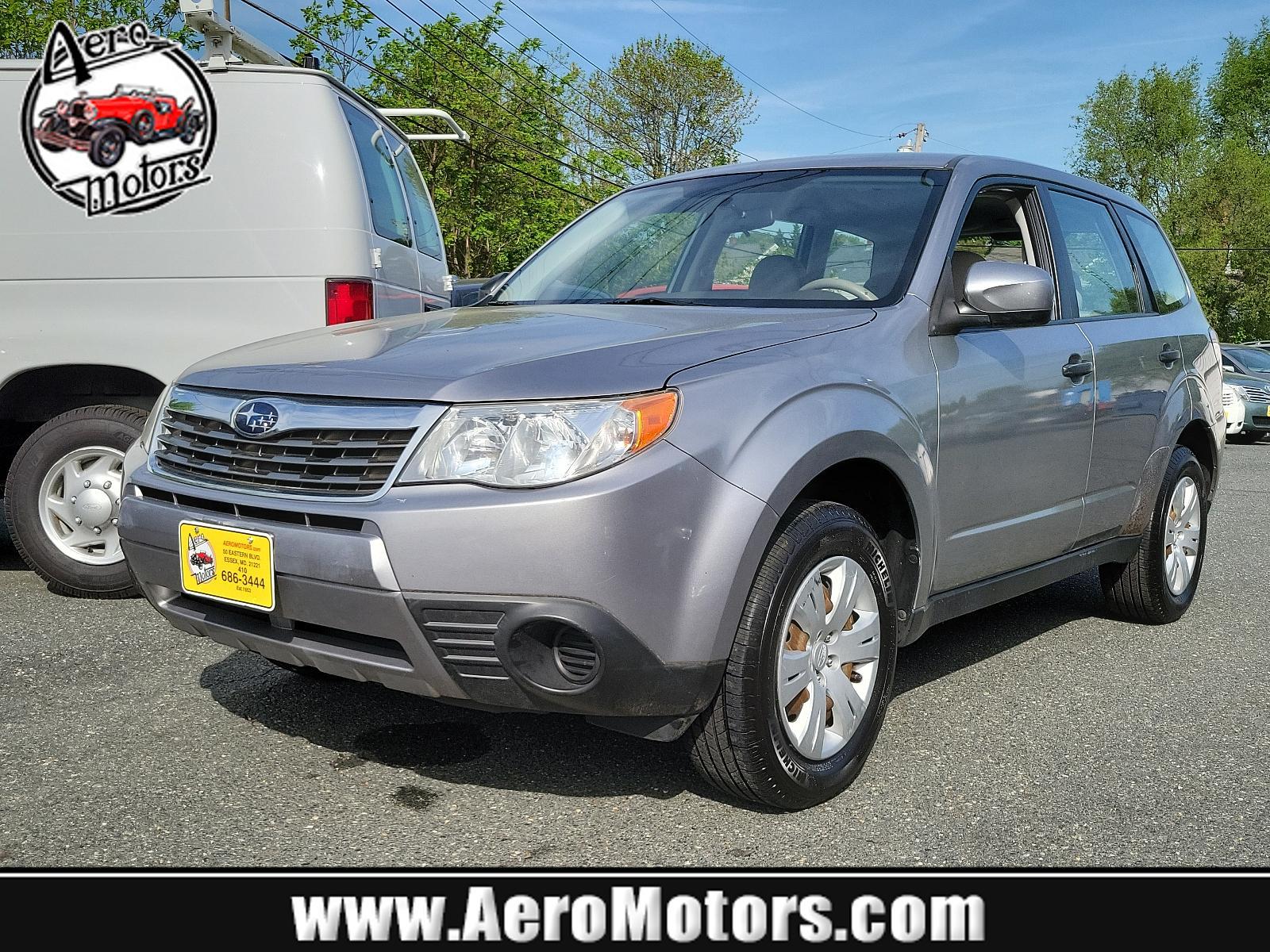2010 Steel Silver Metallic - SSM /Aurora Platinum - APC Subaru Forester 2.5X (JF2SH6AC5AH) with an 2.5L SOHC SMPI 16-valve 4-cyl boxer engine engine, located at 50 Eastern Blvd., Essex, MD, 21221, (410) 686-3444, 39.304367, -76.484947 - Experience the impeccable blend of comfort, style, and performance in this 2010 Subaru Forester 2.5X. Encased in a striking Steel Silver Metallic exterior paired with an elegant Aurora Platinum interior, this SUV is a statement of sophistication. An ideal choice for the discerning driver, the 2.5l S - Photo #0