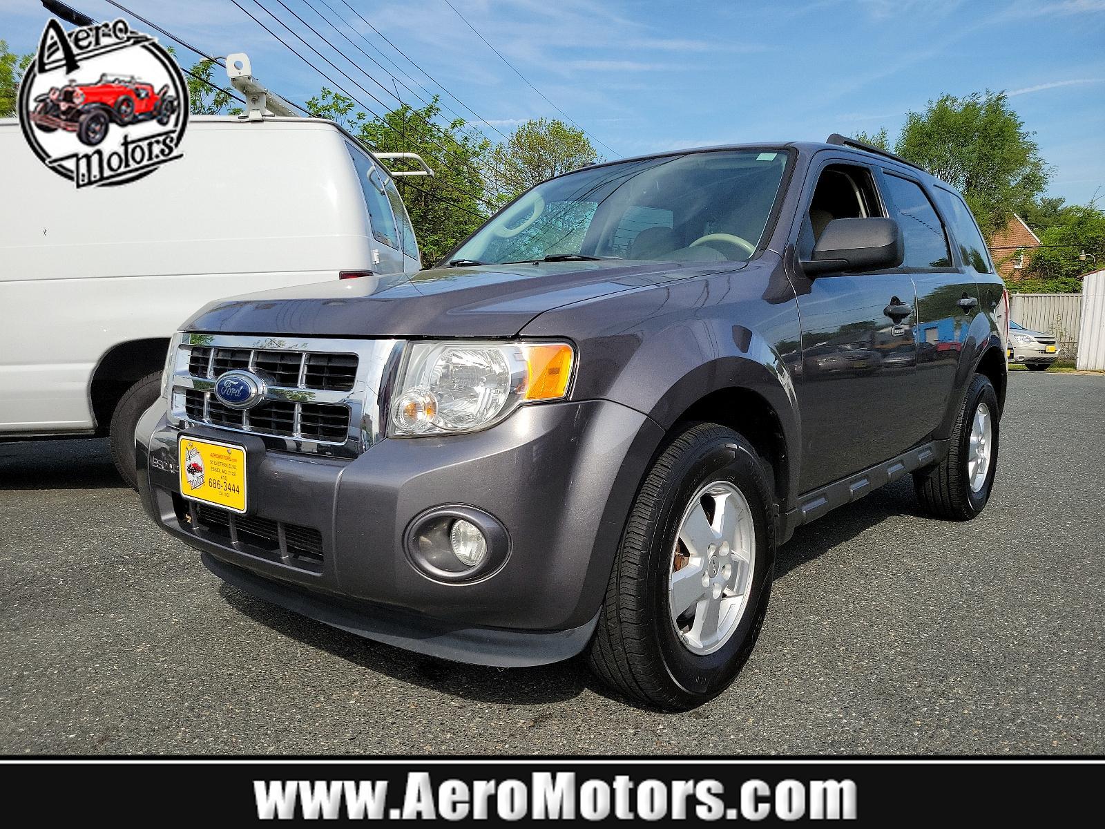 2011 Sterling Grey Metallic - UJ /Stone - 5S Ford Escape XLT (1FMCU0DGXBK) with an 3.0L V6 FLEX FUEL ENGINE engine, located at 50 Eastern Blvd., Essex, MD, 21221, (410) 686-3444, 39.304367, -76.484947 - Discover the captivating blend of style and performance that defines this 2011 Ford Escape XLT. Its power comes from a 3.0L V6 Flex Fuel engine, ensuring robust performance anytime you hit the road. From the exterior to the interior, this vehicle's design is truly a sight to behold. Coated in a stri - Photo #0