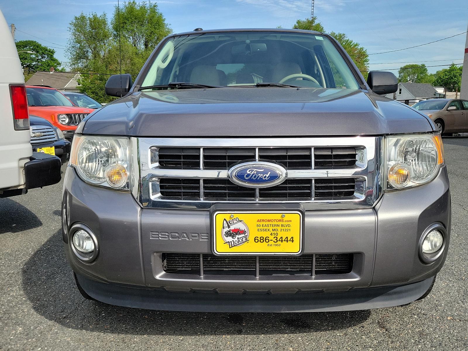 2011 Sterling Grey Metallic - UJ /Stone - 5S Ford Escape XLT (1FMCU0DGXBK) with an 3.0L V6 FLEX FUEL ENGINE engine, located at 50 Eastern Blvd., Essex, MD, 21221, (410) 686-3444, 39.304367, -76.484947 - Discover the captivating blend of style and performance that defines this 2011 Ford Escape XLT. Its power comes from a 3.0L V6 Flex Fuel engine, ensuring robust performance anytime you hit the road. From the exterior to the interior, this vehicle's design is truly a sight to behold. Coated in a stri - Photo #1