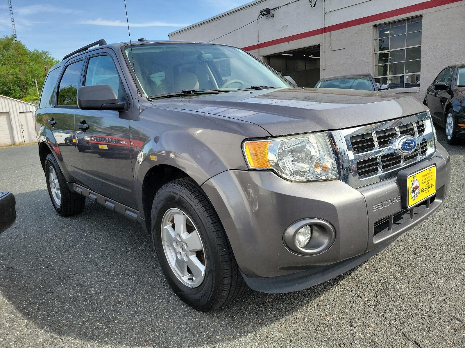 2011 Sterling Grey Metallic - UJ /Stone - 5S Ford Escape XLT (1FMCU0DGXBK) with an 3.0L V6 FLEX FUEL ENGINE engine, located at 50 Eastern Blvd., Essex, MD, 21221, (410) 686-3444, 39.304367, -76.484947 - Discover the captivating blend of style and performance that defines this 2011 Ford Escape XLT. Its power comes from a 3.0L V6 Flex Fuel engine, ensuring robust performance anytime you hit the road. From the exterior to the interior, this vehicle's design is truly a sight to behold. Coated in a stri - Photo #2