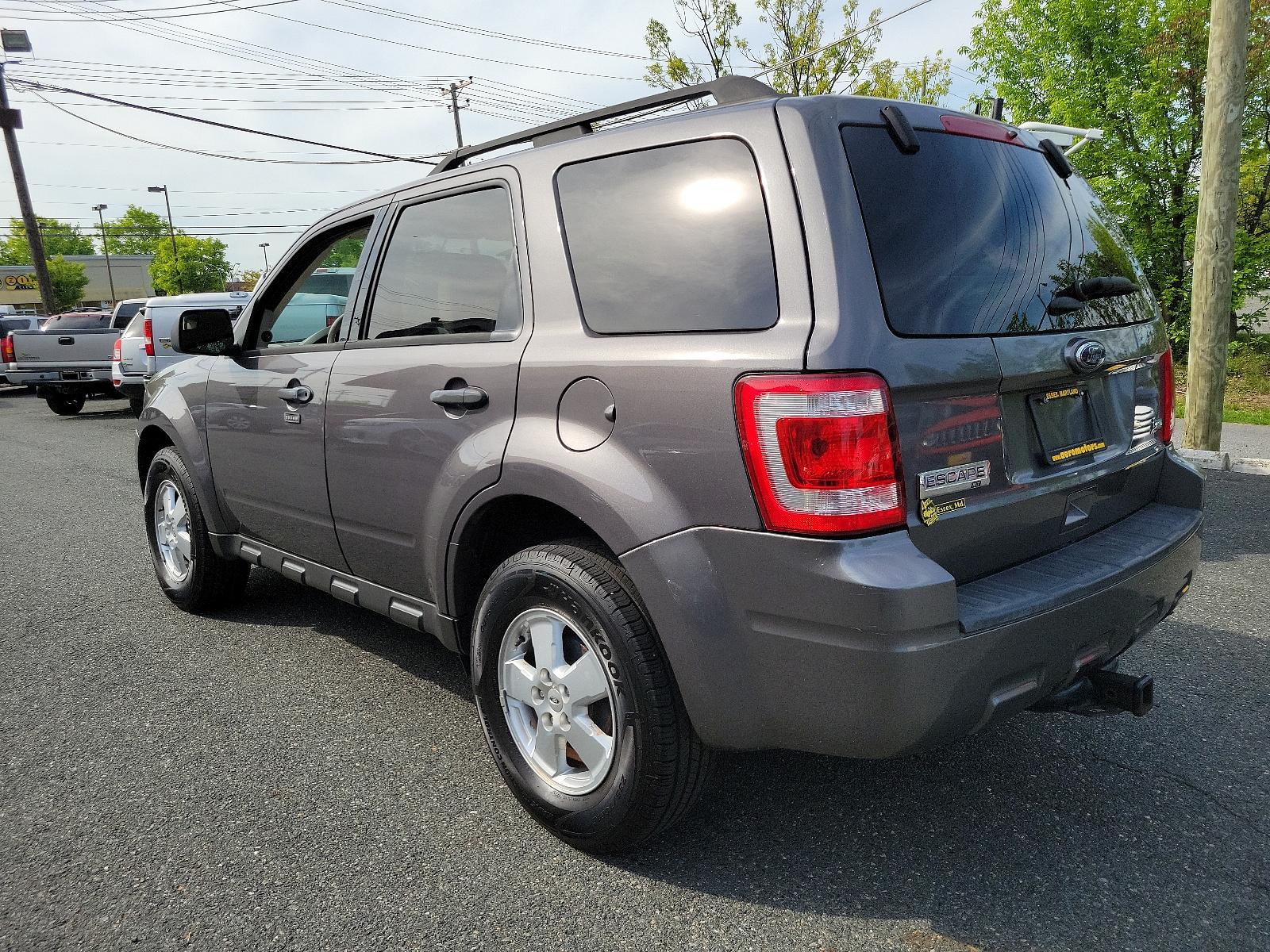 2011 Sterling Grey Metallic - UJ /Stone - 5S Ford Escape XLT (1FMCU0DGXBK) with an 3.0L V6 FLEX FUEL ENGINE engine, located at 50 Eastern Blvd., Essex, MD, 21221, (410) 686-3444, 39.304367, -76.484947 - Discover the captivating blend of style and performance that defines this 2011 Ford Escape XLT. Its power comes from a 3.0L V6 Flex Fuel engine, ensuring robust performance anytime you hit the road. From the exterior to the interior, this vehicle's design is truly a sight to behold. Coated in a stri - Photo #5