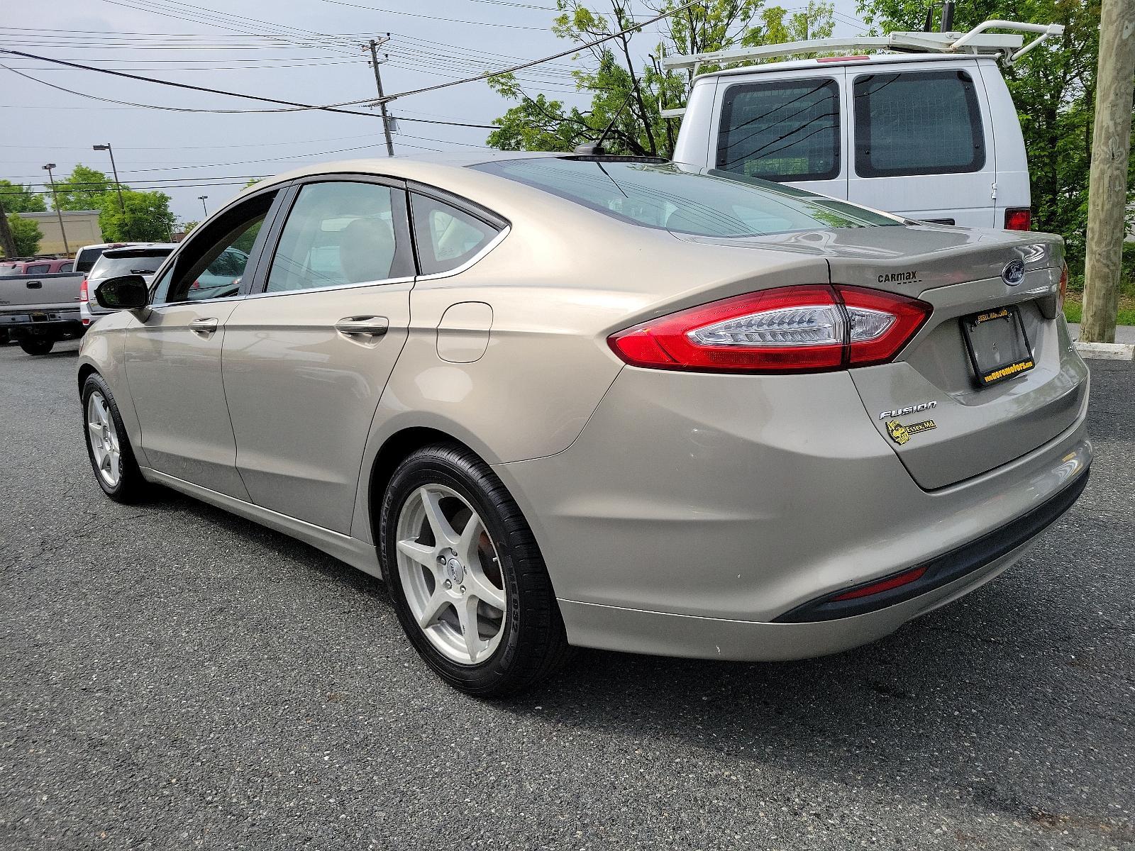 2015 Tectonic - HI /Dune - AQ Ford Fusion SE (3FA6P0H71FR) with an ENGINE: 2.5L IVCT engine, located at 50 Eastern Blvd., Essex, MD, 21221, (410) 686-3444, 39.304367, -76.484947 - Experience the sophisticated blend of performance, efficiency, and style found in this 2015 Ford Fusion SE 4dr sdn se fwd. Unmistakably eye-catching with a sleek Tectonic-hi exterior, it exudes refinement and ivct technology with its sturdy 2.5L engine. This impressive engine ensures smooth, respons - Photo #5