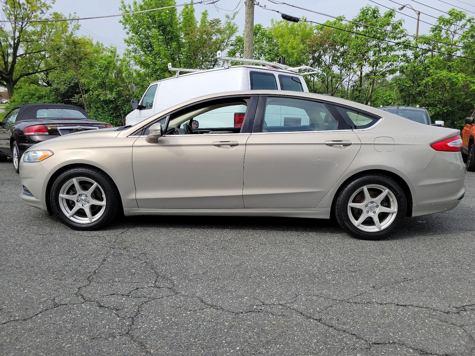 2015 Tectonic - HI /Dune - AQ Ford Fusion SE (3FA6P0H71FR) with an ENGINE: 2.5L IVCT engine, located at 50 Eastern Blvd., Essex, MD, 21221, (410) 686-3444, 39.304367, -76.484947 - Experience the sophisticated blend of performance, efficiency, and style found in this 2015 Ford Fusion SE 4dr sdn se fwd. Unmistakably eye-catching with a sleek Tectonic-hi exterior, it exudes refinement and ivct technology with its sturdy 2.5L engine. This impressive engine ensures smooth, respons - Photo #6