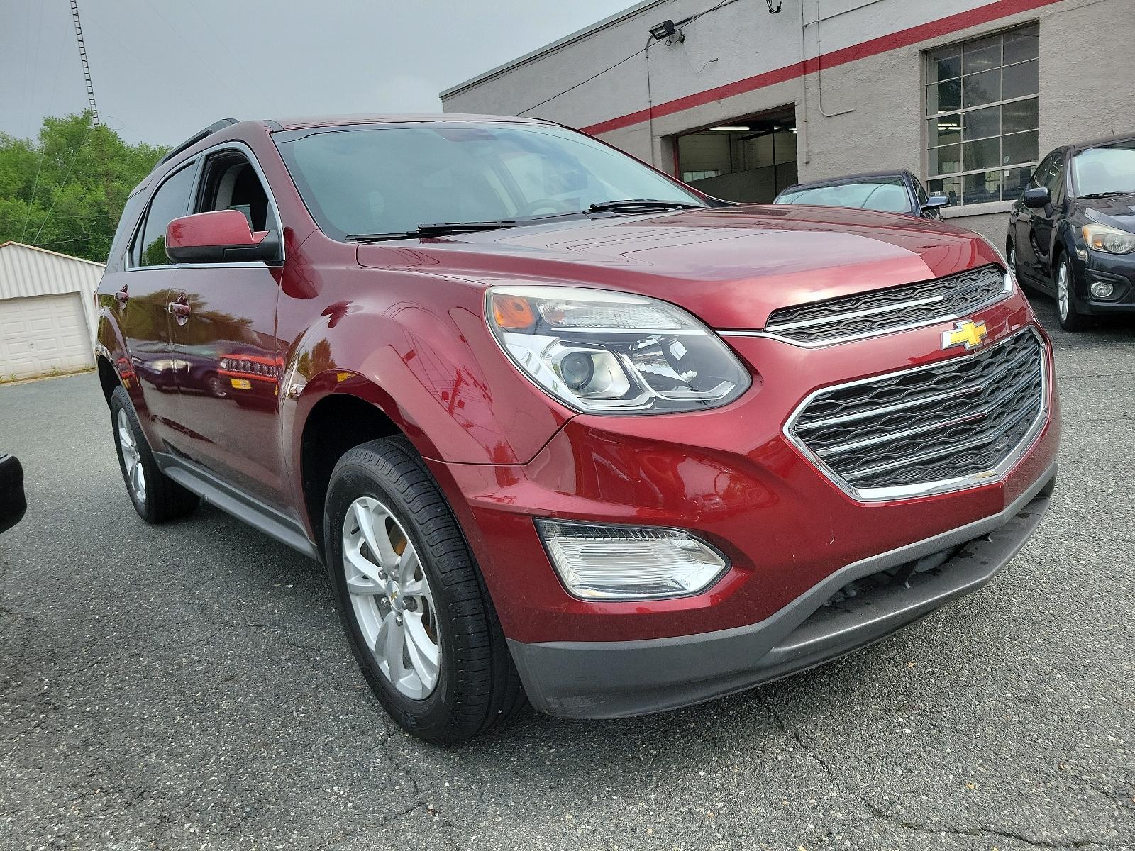 2016 Siren Red Tintcoat - G1E /Jet Black - AFJ Chevrolet Equinox LT (2GNFLFEK0G6) with an ENGINE, 2.4L DOHC 4-CYLINDER SIDI (SPARK IGNITION DIRECT INJECTION) engine, located at 50 Eastern Blvd., Essex, MD, 21221, (410) 686-3444, 39.304367, -76.484947 - Experience the symphony of power and comfort with our 2016 Chevrolet Equinox LT. Coated in a captivating Siren Red Tintcoat G1E exterior, this AWD 4dr LT assessment injects an aura of elegance and sportiness in your daily commute. Enter the cabin, and the luxurious Jet Black - AFJ interior will welc - Photo #2