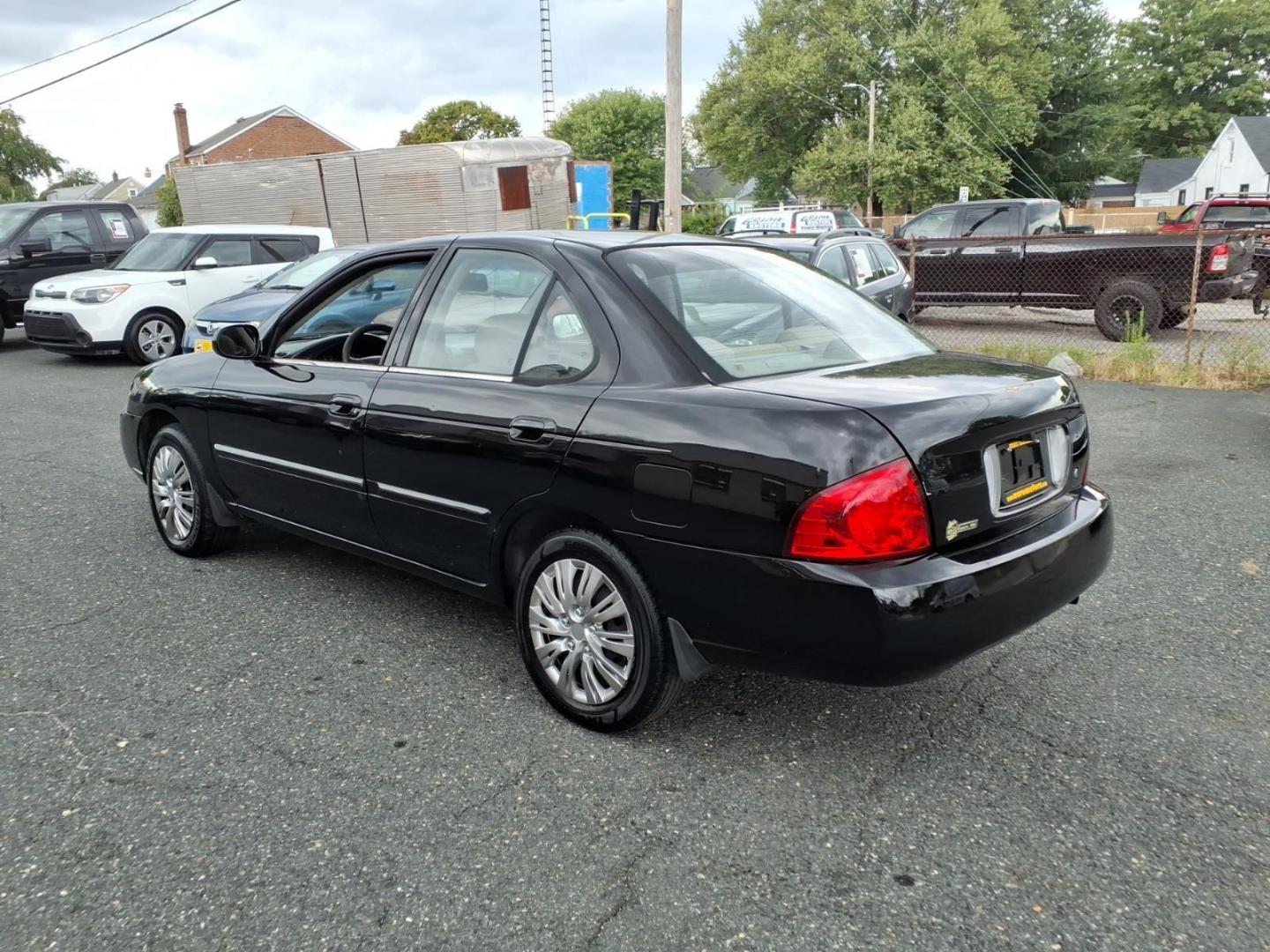 2004 Blackout Nissan Sentra 1.8 S (3N1CB51D54L) with an 1.8L 1L NA I4 double overhead cam (DOHC) 16V Fuel Injected engine, Automatic transmission, located at 50 Eastern Blvd., Essex, MD, 21221, (410) 686-3444, 39.304367, -76.484947- Photo#2