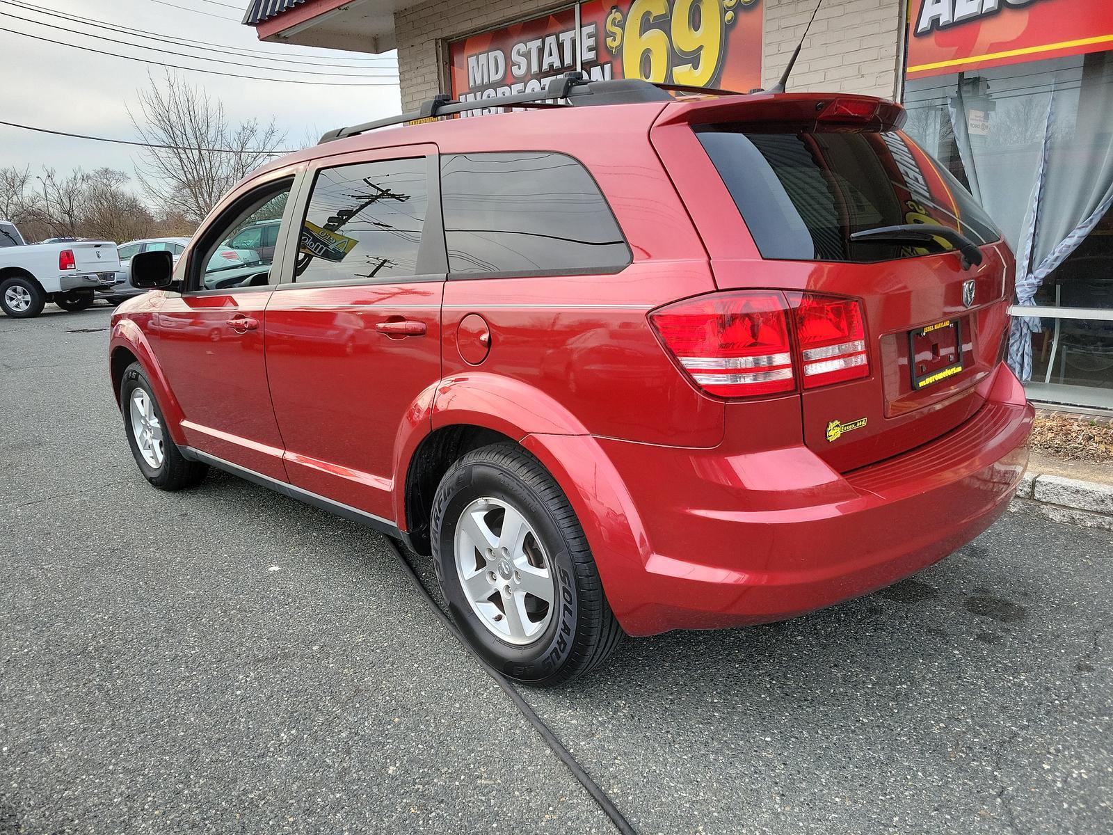 2010 Inferno Red Crystal Pearl /Dark Slate Gray Dodge Journey SE (3D4PG4FB1AT) with an 2.4L DOHC DUAL VVT 16-VALVE I4 ENGINE engine, located at 50 Eastern Blvd., Essex, MD, 21221, (410) 686-3444, 39.304367, -76.484947 - <p>Climb inside this versatile 2010 Dodge Journey SE in Inferno Red Crystal Pearl that is the ideal balance of a minivan, station wagon, and family sedan. Powered by a 2.4 Liter 4 Cylinder generating 173hp connected to a 4 Speed Automatic transmission. You will enjoy plenty of power to merge and pas - Photo #5