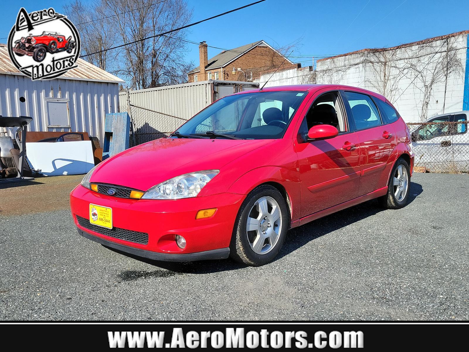 2003 Infra Red - E4 /Black/Red - R Ford Focus ZX5 Comfort (3FAHP37553R) , located at 50 Eastern Blvd., Essex, MD, 21221, (410) 686-3444, 39.304367, -76.484947 - <p>Our 2003 Ford Focus ZX5 Comfort Hatchback in Infra Red is a great choice for your active lifestyle! Powered by a 2.3 Liter 4 Cylinder generating 145hp connected to a 5 Speed Manual transmission. This Front Wheel Drive hatchback shows off with up to 33mpg on the highway and unique styling. Power m - Photo #0
