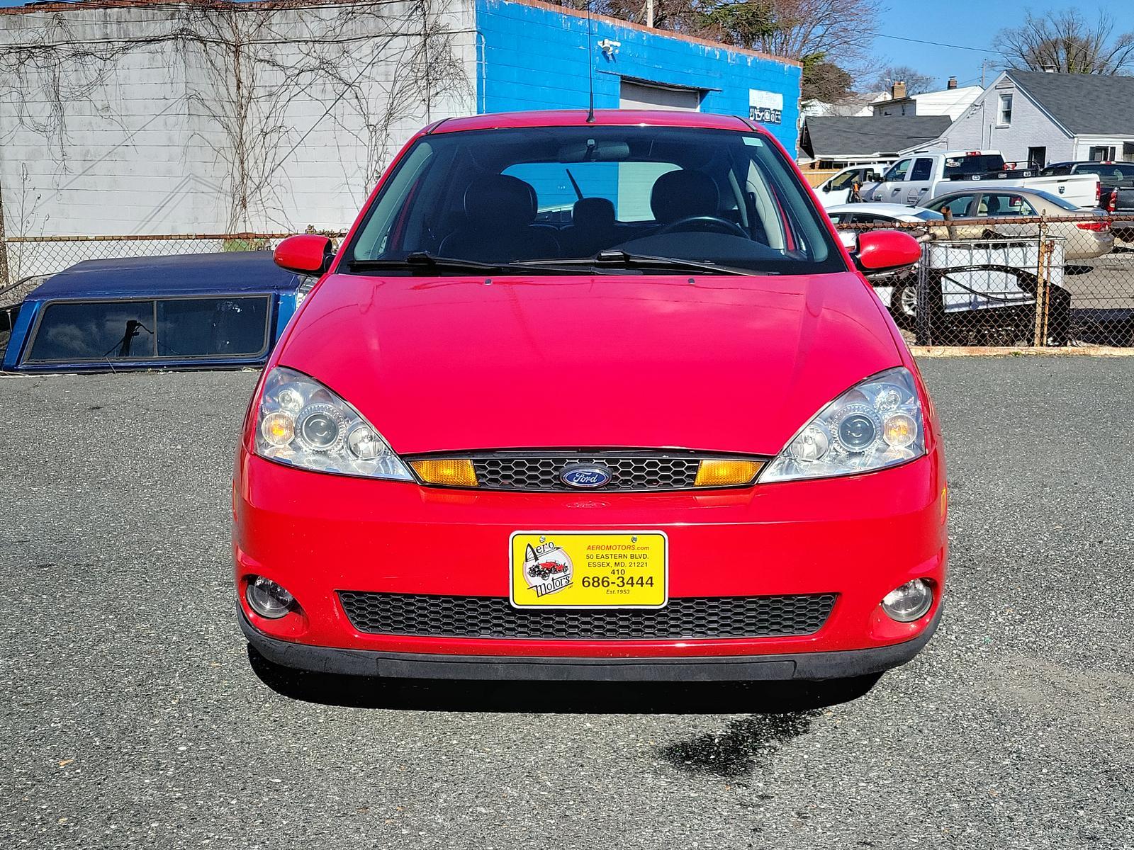 2003 Infra Red - E4 /Black/Red - R Ford Focus ZX5 Comfort (3FAHP37553R) , located at 50 Eastern Blvd., Essex, MD, 21221, (410) 686-3444, 39.304367, -76.484947 - <p>Our 2003 Ford Focus ZX5 Comfort Hatchback in Infra Red is a great choice for your active lifestyle! Powered by a 2.3 Liter 4 Cylinder generating 145hp connected to a 5 Speed Manual transmission. This Front Wheel Drive hatchback shows off with up to 33mpg on the highway and unique styling. Power m - Photo #1