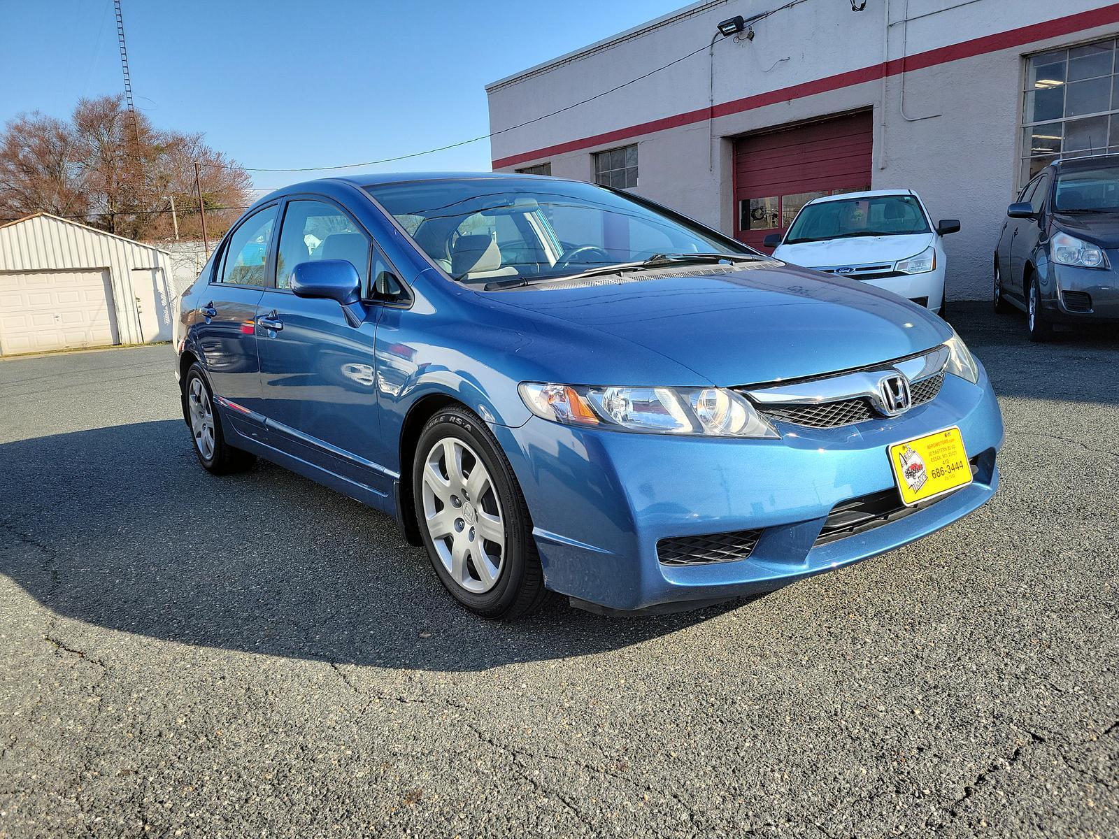 2009 Atomic Blue Metallic - BL /Gray - GR Honda Civic Sdn LX (2HGFA16539H) with an 1.8L SOHC MPFI 16-valve i-VTEC I4 engine engine, located at 50 Eastern Blvd., Essex, MD, 21221, (410) 686-3444, 39.304367, -76.484947 - <p>Our 2009 Honda Civic LX Sedan presented in Atomic Blue Metallic takes your drive to the next level! Powered by a 1.8 Liter 4 Cylinder offering 140hp paired to a 5 Speed Automatic transmission for fantastic passing authority. This Front Wheel Drive sedan rewards you with nearly 36mpg on the highwa - Photo #2