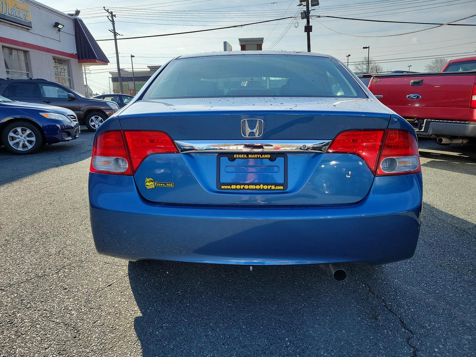 2009 Atomic Blue Metallic - BL /Gray - GR Honda Civic Sdn LX (2HGFA16539H) with an 1.8L SOHC MPFI 16-valve i-VTEC I4 engine engine, located at 50 Eastern Blvd., Essex, MD, 21221, (410) 686-3444, 39.304367, -76.484947 - <p>Our 2009 Honda Civic LX Sedan presented in Atomic Blue Metallic takes your drive to the next level! Powered by a 1.8 Liter 4 Cylinder offering 140hp paired to a 5 Speed Automatic transmission for fantastic passing authority. This Front Wheel Drive sedan rewards you with nearly 36mpg on the highwa - Photo #4