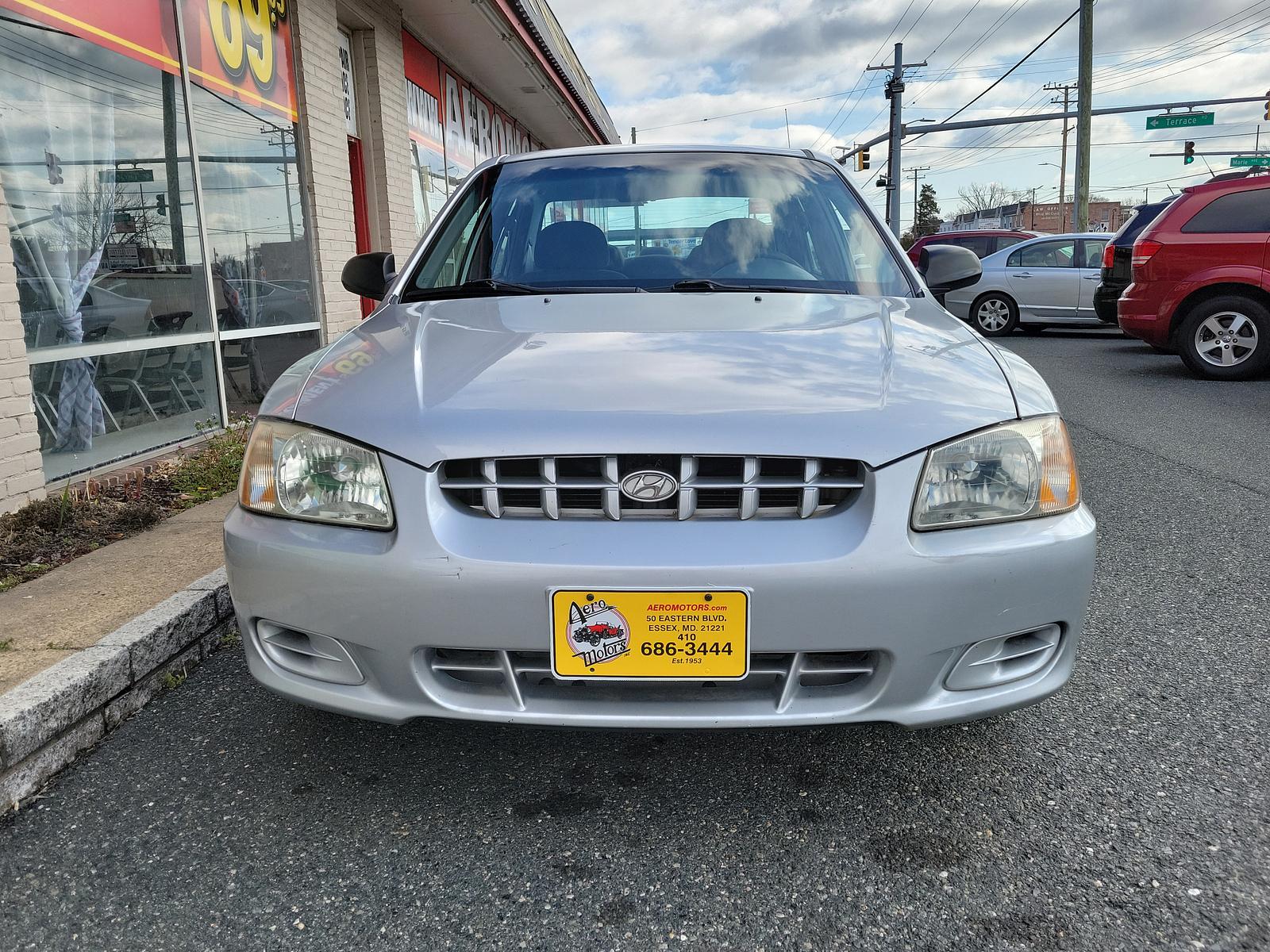 2000 Silver Mist - CS /Gray - LT Hyundai Accent GL (KMHCG45G5YU) with an 1.5L SOHC MPI 12 valve 4 cyl engine engine, located at 50 Eastern Blvd., Essex, MD, 21221, (410) 686-3444, 39.304367, -76.484947 - <p>Our 2000 Hyundai Accent GL Sedan is a great car shown off in Silver Mist! Powered by a 1.6 Liter 4 Cylinder connected to a 4 Speed Automated transmission for easy passing commands. This Front Wheel Drive sedan provides up to 35mpg on the highway and handles well to make for a perfect commuter aro - Photo #1