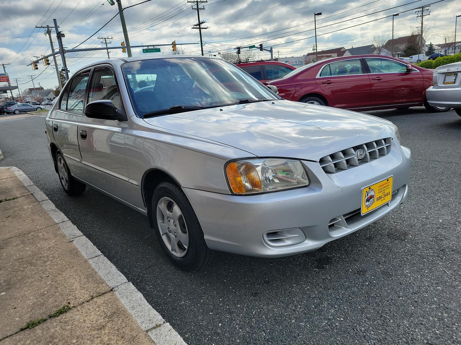 2000 Silver Mist - CS /Gray - LT Hyundai Accent GL (KMHCG45G5YU) with an 1.5L SOHC MPI 12 valve 4 cyl engine engine, located at 50 Eastern Blvd., Essex, MD, 21221, (410) 686-3444, 39.304367, -76.484947 - <p>Our 2000 Hyundai Accent GL Sedan is a great car shown off in Silver Mist! Powered by a 1.6 Liter 4 Cylinder connected to a 4 Speed Automated transmission for easy passing commands. This Front Wheel Drive sedan provides up to 35mpg on the highway and handles well to make for a perfect commuter aro - Photo #2