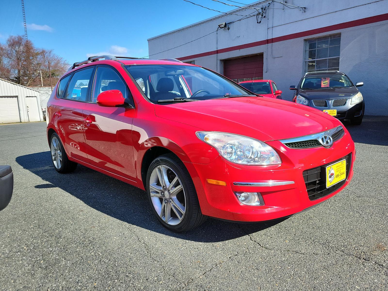 2011 Chilipepper Red - JA /Black - XP Hyundai Elantra Touring SE (KMHDC8AEXBU) with an 2.0L DOHC CVVT 16-valve I4 engine engine, located at 50 Eastern Blvd., Essex, MD, 21221, (410) 686-3444, 39.304367, -76.484947 - <p>Our 2011 Hyundai Elantra Touring SE Hatchback is offered in a unique Chili Pepper Red exterior finish. Powered by a 2.0 Liter 4 Cylinder that offers 138hp paired to a 4 Speed Automatic transmission wh SHIFTRONIC. Together, this Front Wheel Drive hatchback makes the drive entertaining and enjoyabl - Photo #2