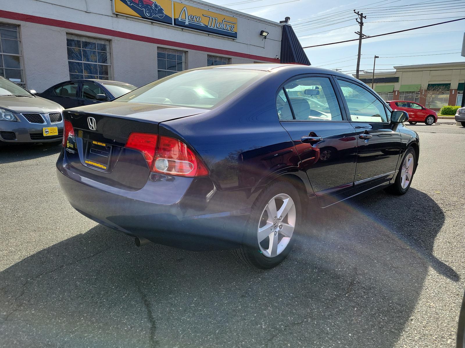 2006 Atomic Blue Metallic - BB /Ivory - IV Honda Civic Sdn EX (1HGFA16896L) with an 1.8L SOHC MPFI 16-valve i-VTEC I4 engine engine, located at 50 Eastern Blvd., Essex, MD, 21221, (410) 686-3444, 39.304367, -76.484947 - <p>Indulge yourself with our fantastic 2006 Honda Civic EX Sedan proudly displayed in Silver. Powered by an efficient 1.8 Liter 4 Cylinder offering 140hp blended with a responsive 5 Speed Automatic transmission for easy passing. This Front Wheel Drive sedan scores near 36mpg on the open road. On the - Photo #3