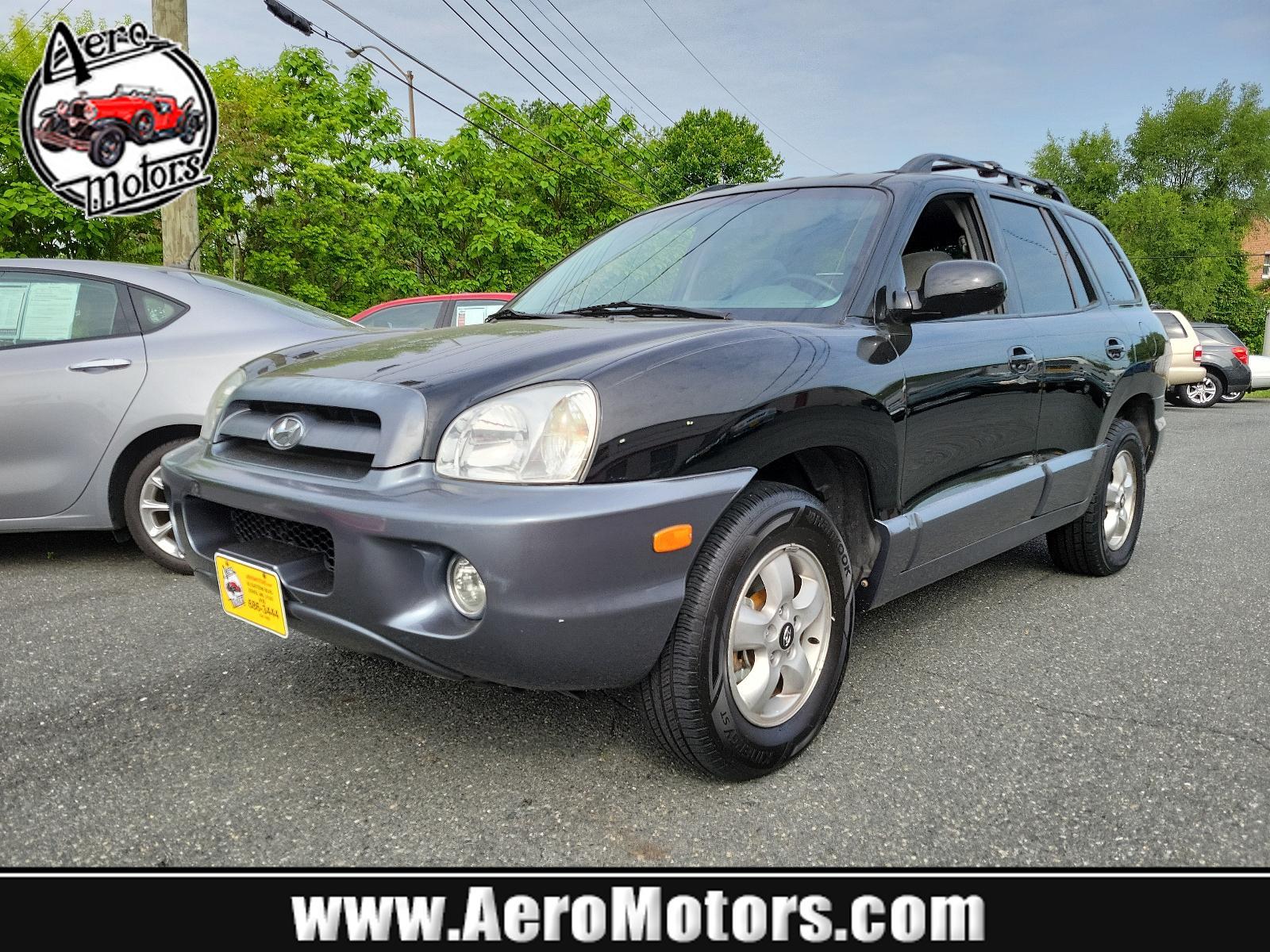 2006 Black Obsidian - ED /Gray - YD Hyundai Santa Fe GLS (KM8SC73D56U) with an 2.7L DOHC MPI 24-valve V6 engine engine, located at 50 Eastern Blvd., Essex, MD, 21221, (410) 686-3444, 39.304367, -76.484947 - <p>Our 2006 Hyundai Santa Fe GLS 4WD in Black Obsidian blends the best attributes of traditional SUVs with a driving character like that of a mid-sized sedan. Powered by a 2.7 Liter V6 generating 200hp coupled to a 5 Speed Automatic transmission. This Four Wheel Drive SUV earns up to mpg on the high - Photo #0