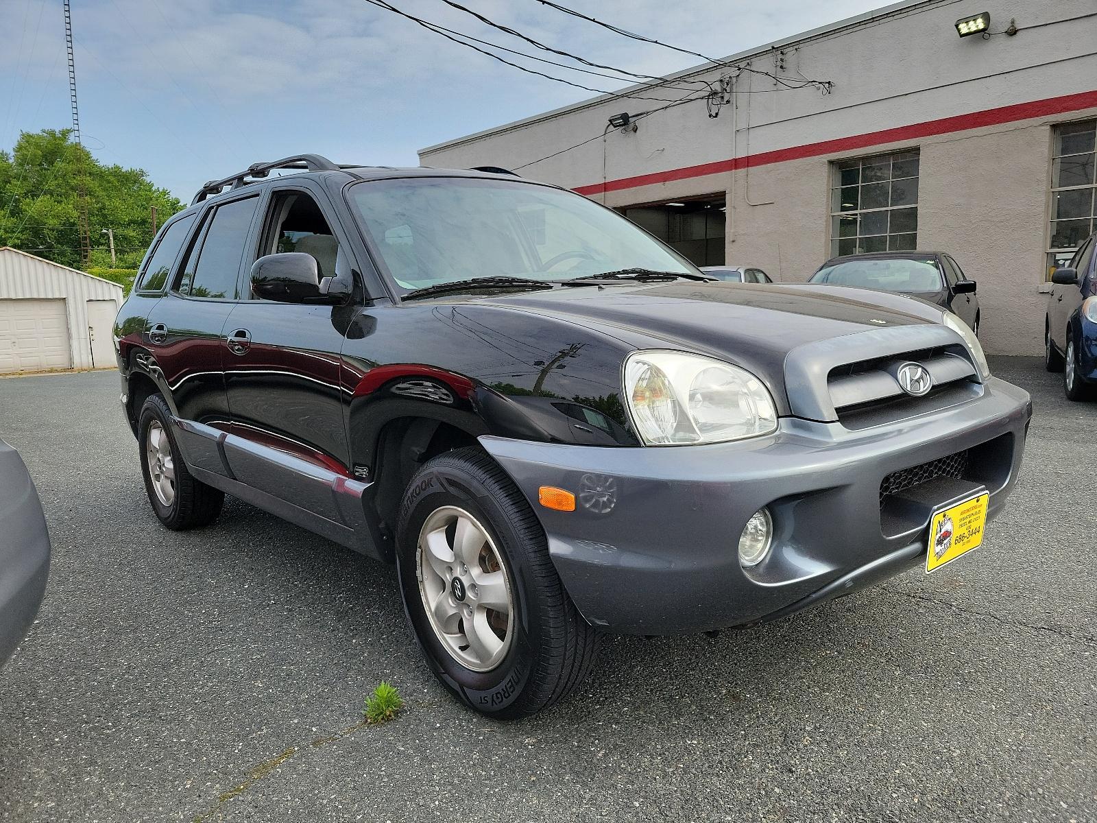 2006 Black Obsidian - ED /Gray - YD Hyundai Santa Fe GLS (KM8SC73D56U) with an 2.7L DOHC MPI 24-valve V6 engine engine, located at 50 Eastern Blvd., Essex, MD, 21221, (410) 686-3444, 39.304367, -76.484947 - <p>Our 2006 Hyundai Santa Fe GLS 4WD in Black Obsidian blends the best attributes of traditional SUVs with a driving character like that of a mid-sized sedan. Powered by a 2.7 Liter V6 generating 200hp coupled to a 5 Speed Automatic transmission. This Four Wheel Drive SUV earns up to mpg on the high - Photo #2