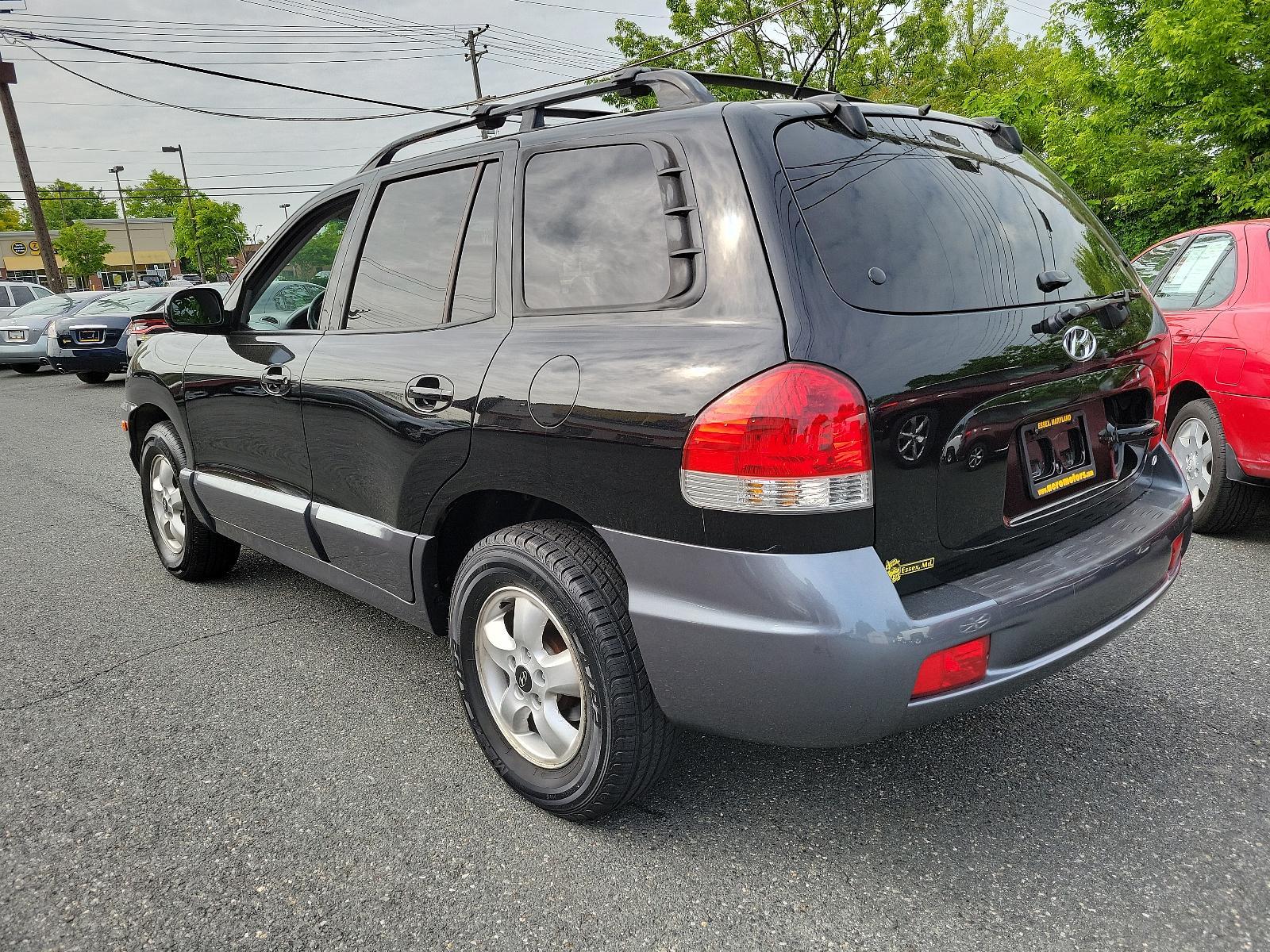 2006 Black Obsidian - ED /Gray - YD Hyundai Santa Fe GLS (KM8SC73D56U) with an 2.7L DOHC MPI 24-valve V6 engine engine, located at 50 Eastern Blvd., Essex, MD, 21221, (410) 686-3444, 39.304367, -76.484947 - <p>Our 2006 Hyundai Santa Fe GLS 4WD in Black Obsidian blends the best attributes of traditional SUVs with a driving character like that of a mid-sized sedan. Powered by a 2.7 Liter V6 generating 200hp coupled to a 5 Speed Automatic transmission. This Four Wheel Drive SUV earns up to mpg on the high - Photo #5