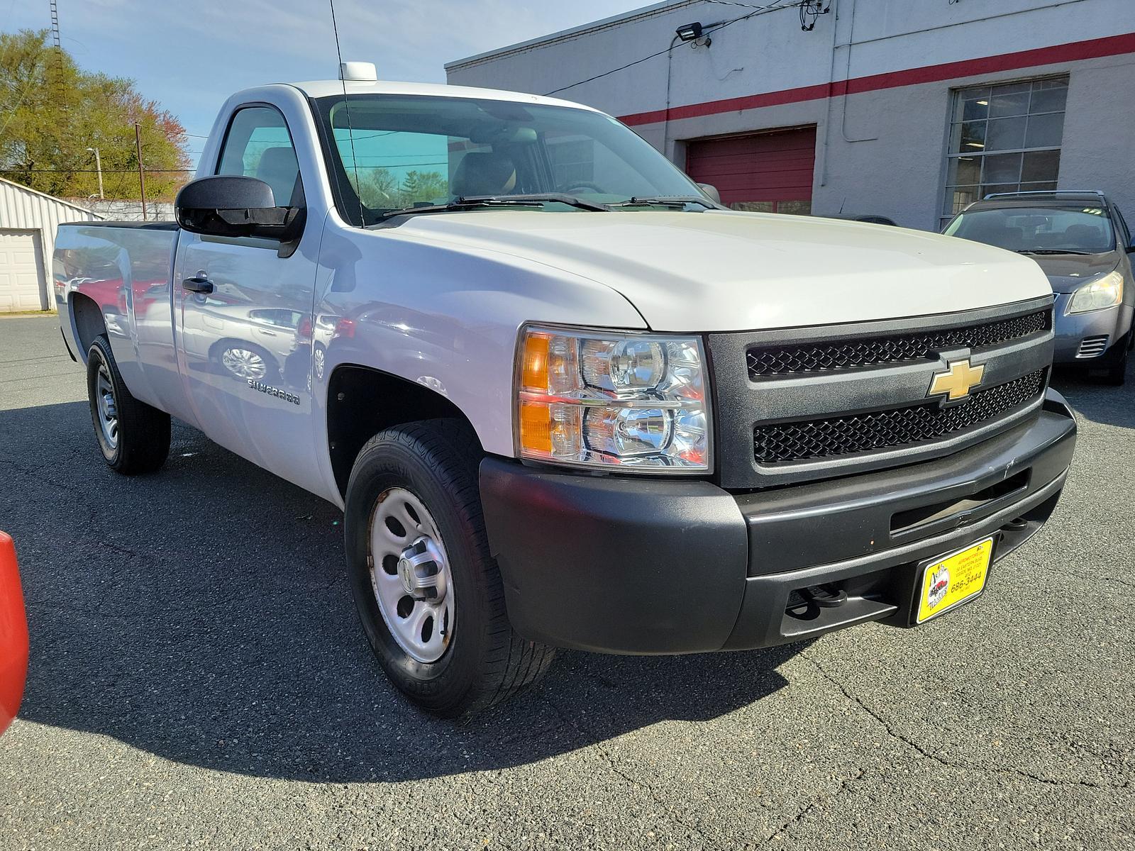 2011 Summit White - 50U /Dark Titanium - 88B Chevrolet Silverado 1500 Work Truck (1GCNKPEA9BZ) with an ENGINE, VORTEC 4.8L VARIABLE VALVE TIMING V8 SFI FLEXFUEL engine, located at 50 Eastern Blvd., Essex, MD, 21221, (410) 686-3444, 39.304367, -76.484947 - <p>Admire our great looking 2011 Chevrolet Silverado 1500 W/T Regular Cab 4X4 presented in Summit White. Powered by a 5.3 Liter V8 delivering 315hp while paired to a durable Automatic transmission for easy towing. This Four Wheel Drive will meet all your hauling and towing needs and looks good while - Photo #2