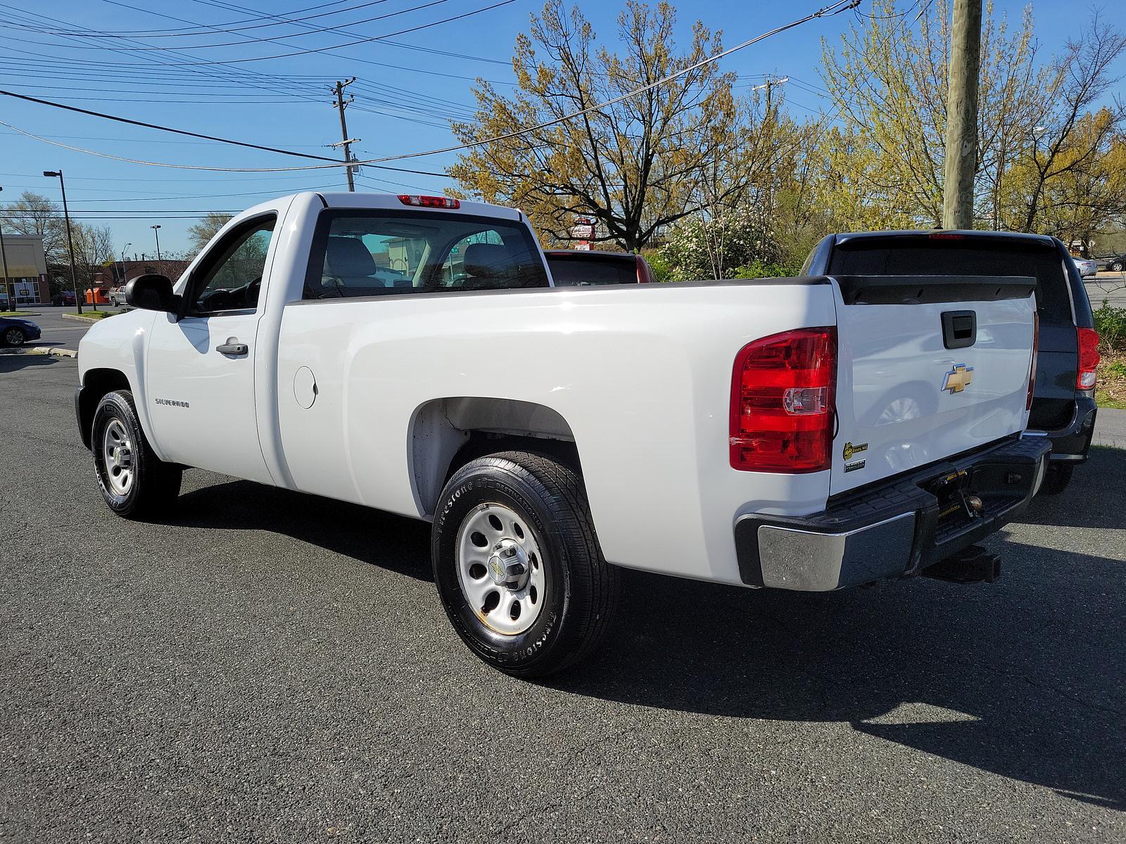 2011 Summit White - 50U /Dark Titanium - 88B Chevrolet Silverado 1500 Work Truck (1GCNKPEA9BZ) with an ENGINE, VORTEC 4.8L VARIABLE VALVE TIMING V8 SFI FLEXFUEL engine, located at 50 Eastern Blvd., Essex, MD, 21221, (410) 686-3444, 39.304367, -76.484947 - <p>Admire our great looking 2011 Chevrolet Silverado 1500 W/T Regular Cab 4X4 presented in Summit White. Powered by a 5.3 Liter V8 delivering 315hp while paired to a durable Automatic transmission for easy towing. This Four Wheel Drive will meet all your hauling and towing needs and looks good while - Photo #5