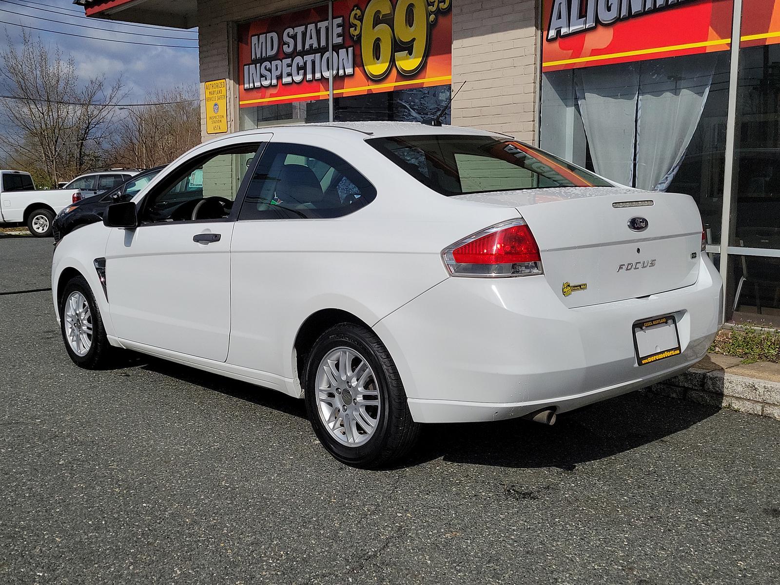 2008 Oxford White - YZ /Medium Stone - S Ford Focus SE (1FAHP33N48W) with an 2.0L DOHC 16-VALVE I4 DURATEC ENGINE engine, located at 50 Eastern Blvd., Essex, MD, 21221, (410) 686-3444, 39.304367, -76.484947 - <p>This 2008 Ford Focus SE Coupe shown in Oxford White should be on your shortlist. Powered by a 2.0 Liter 4 Cylinder that generates 132hp while combined with an Automatic transmission. This Front Wheel Drive accelerates briskly and loves to show the pep in its step while scoring near 35mpg on the h - Photo #5