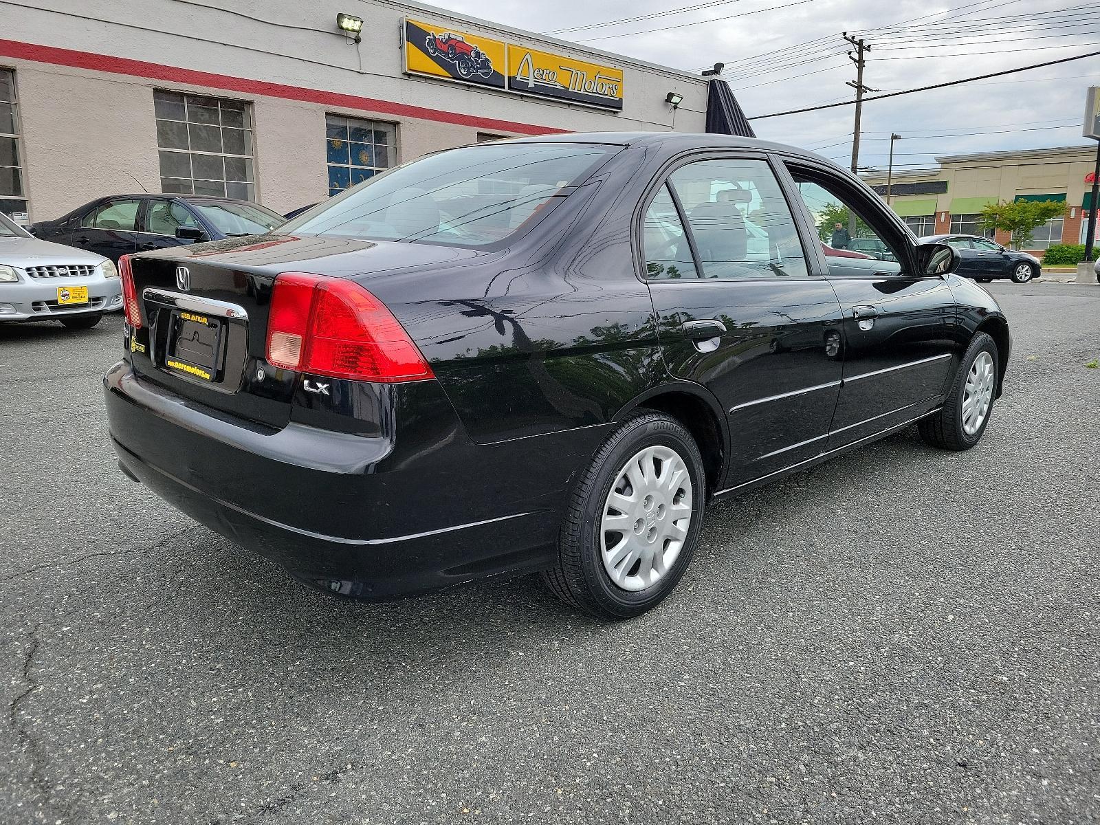 2005 Nighthawk Black Pearl - BK /Gray - GR Honda Civic Sdn LX (JHMES16525S) with an 1.7L SOHC MPFI 16-valve I4 engine engine, located at 50 Eastern Blvd., Essex, MD, 21221, (410) 686-3444, 39.304367, -76.484947 - <p>Practical, efficient, and fun to drive, this 2005 Honda Civic LX Sedan in Nighthawk Black Pearl lives up to its reputation! Powered by a 1.7 Liter 4 Cylinder generating 115hp while connected to the 5 Speed Manual transmission to make the most out of every mile. One trip in our Front Wheel Drive H - Photo #3
